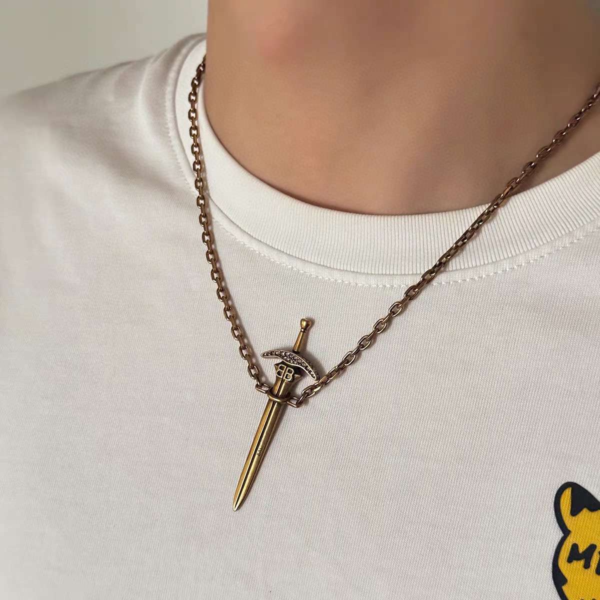 Balenciaga BB Logo Rhinestone Embellished Dagger Sword Pendant Bronze Tone Necklace - KAIROO