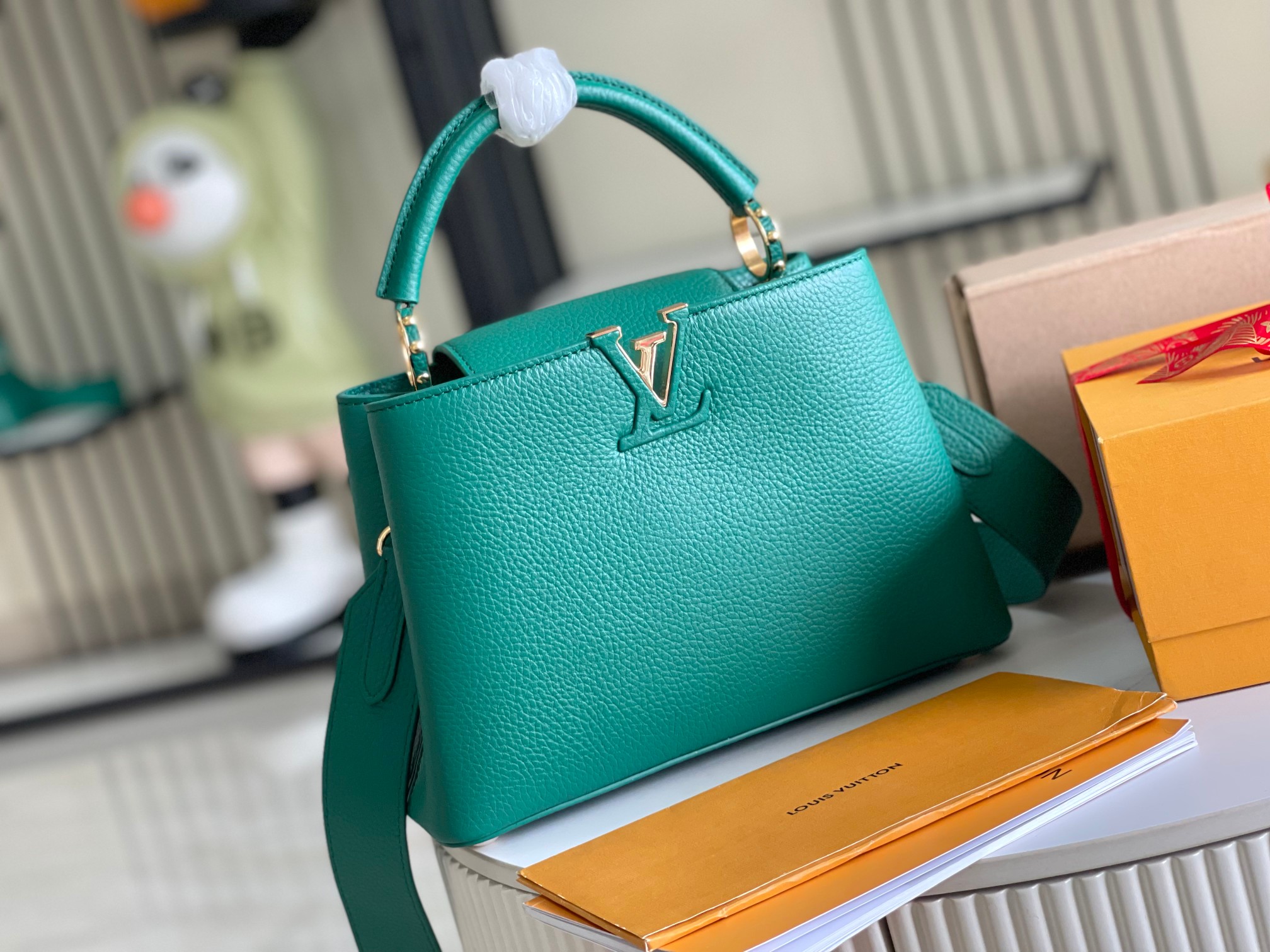 M24739 Capucines BB in Emerald Green Taurillon leather