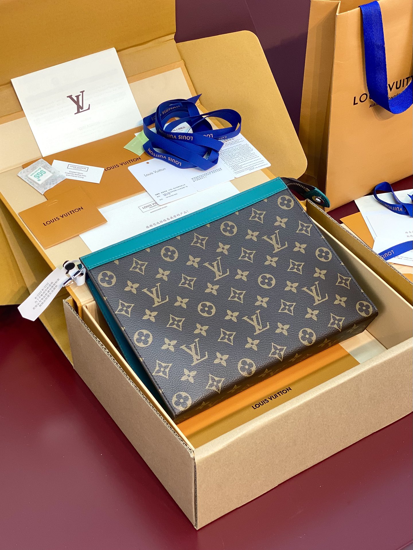 M12816 Pochette Voyage MM in Borneo Green Monogram Macassar coated canvas