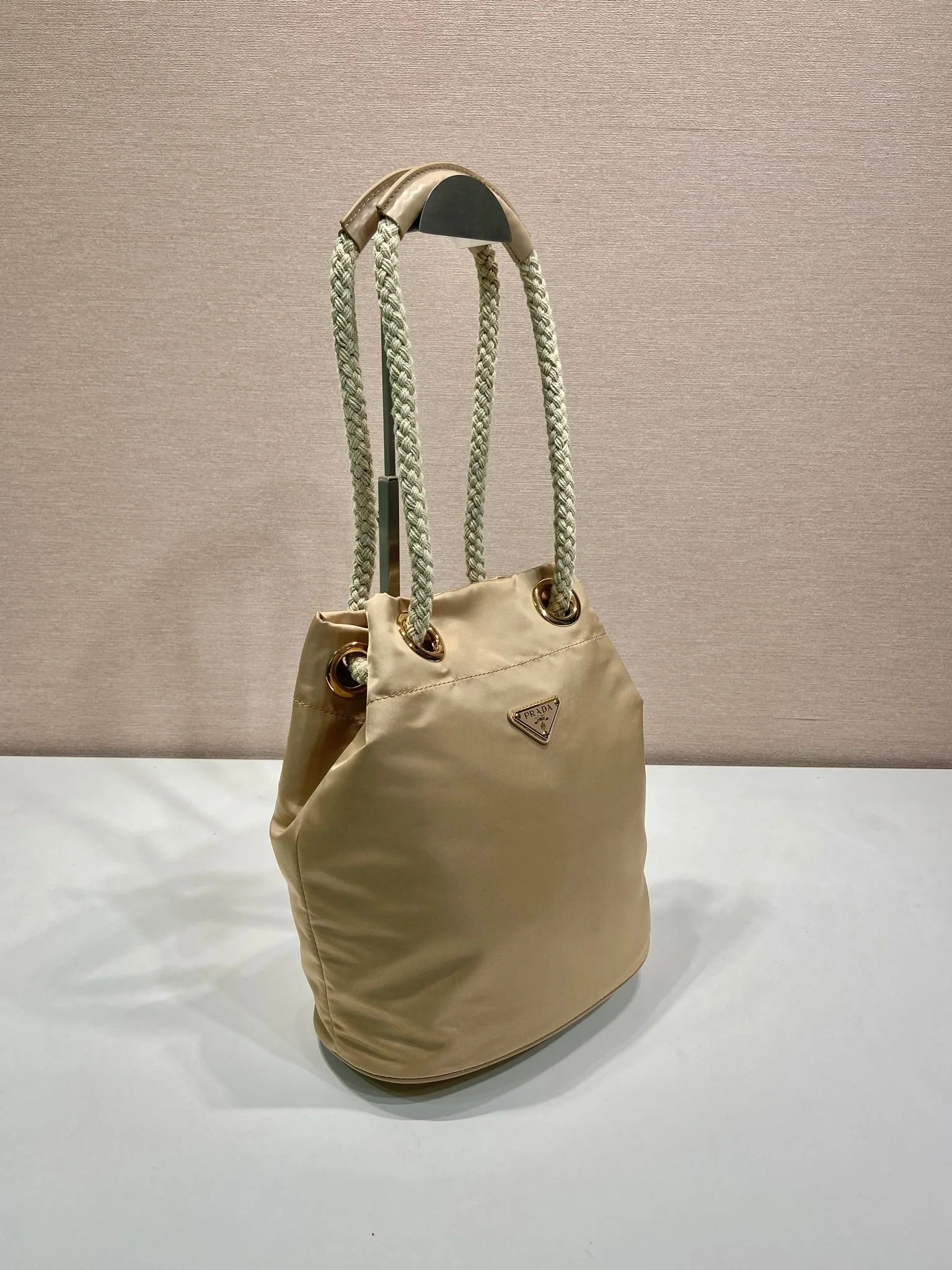 Prada BUCKET BAG 28 IN BEIGE RE-NYLON GOLD LOGO