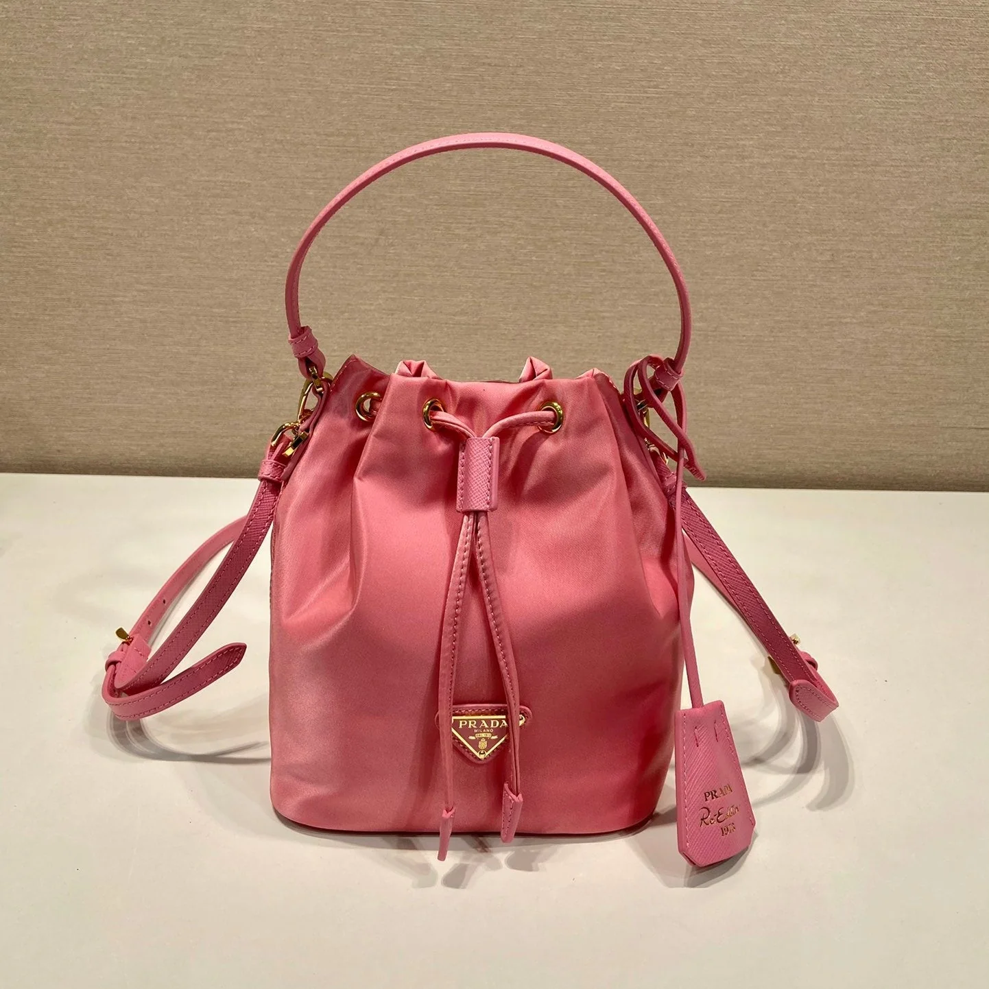 Prada BUCKET BAG 19 IN CANDY PINK RE-NYLON AND SAFFIANO LEATHER HANDLE