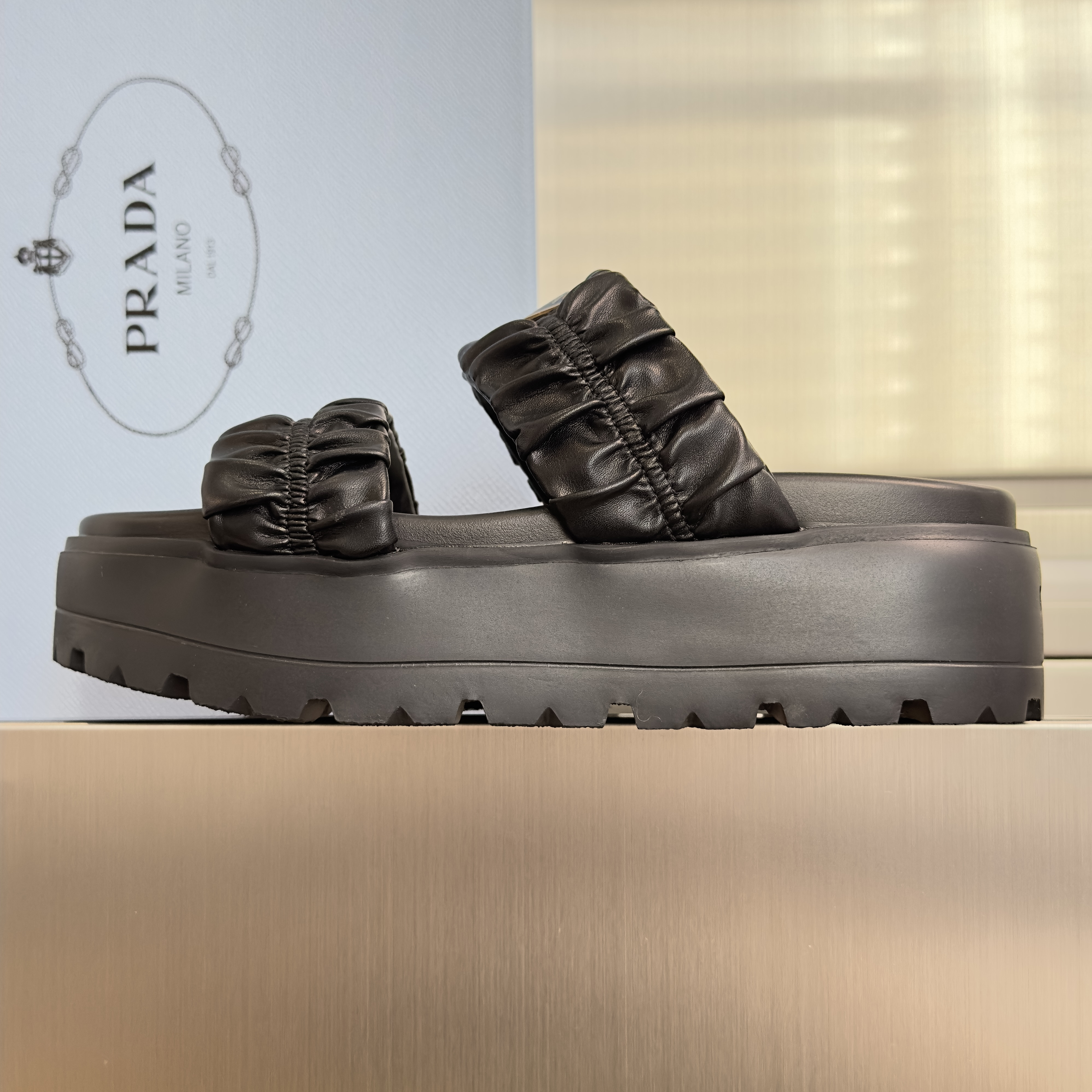 Prada Matelassé nappa leather flatform slides