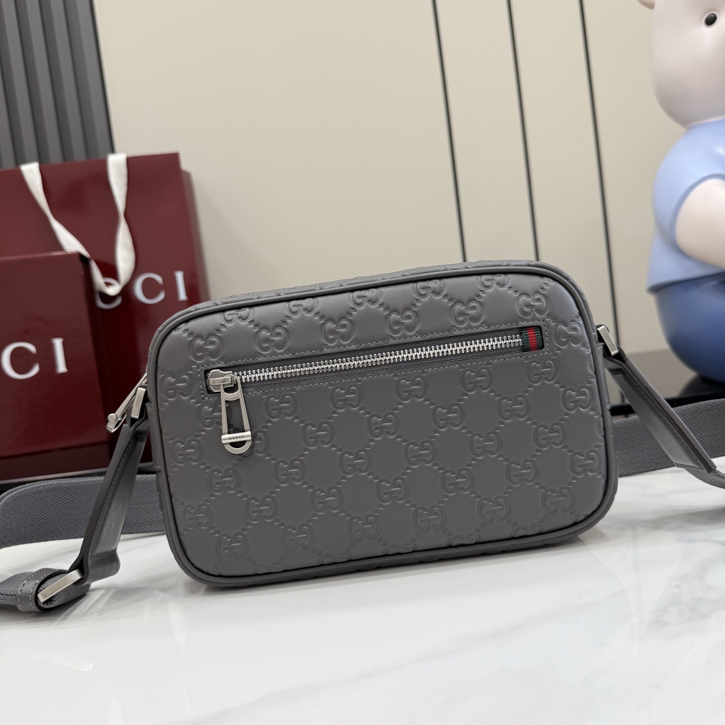 Gucci GG Emblem small crossbody bag 850242