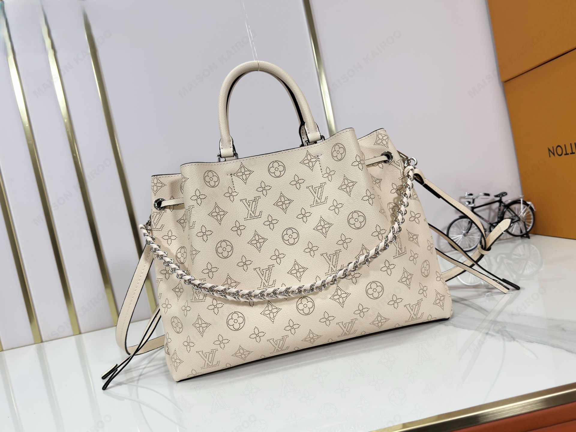 Louis Vuitton LV Mahina Bella Tote Ivory Perforated Monogram Leather Drawstring Bucket Top Handle Bag - KAIROO