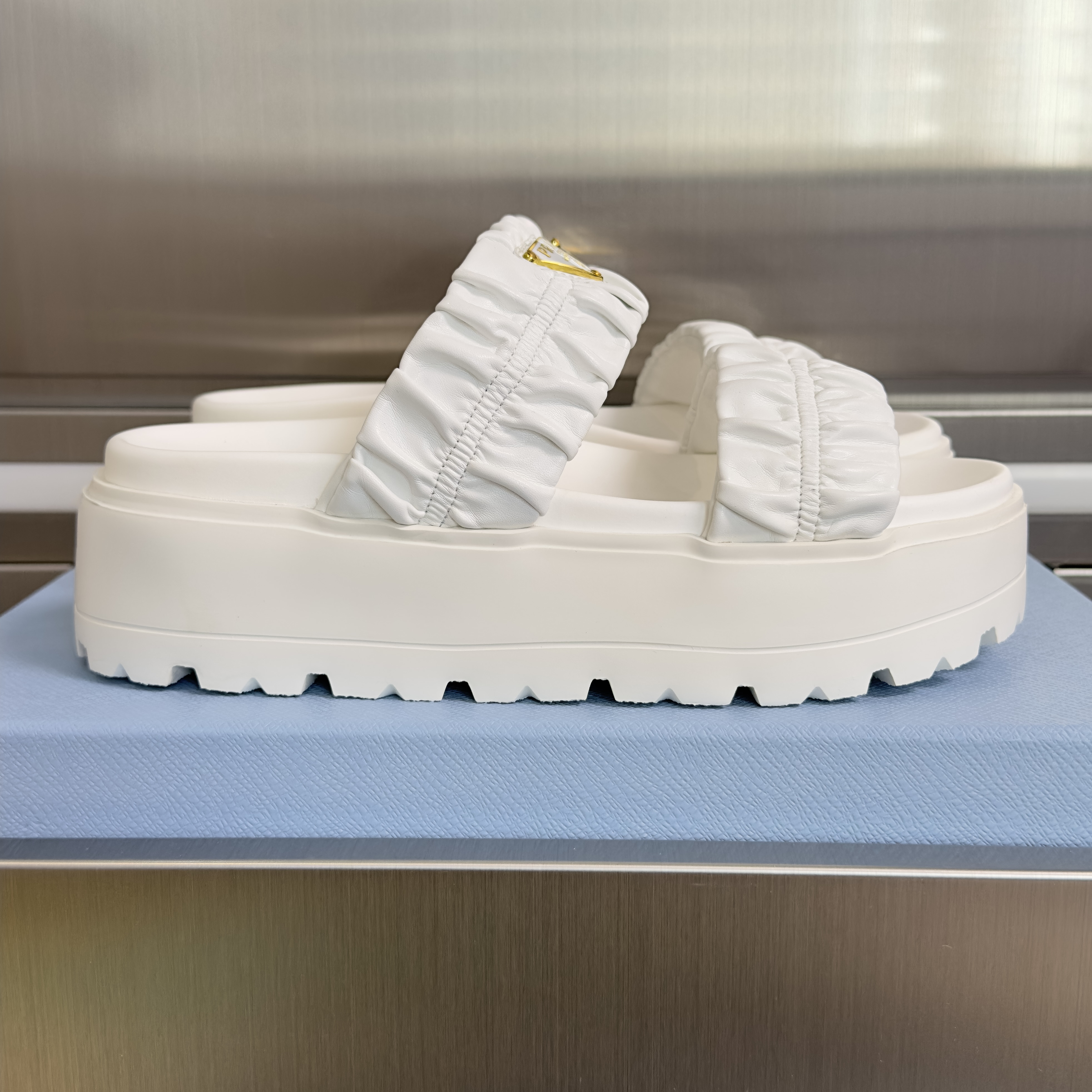 Prada Matelassé nappa leather flatform slides