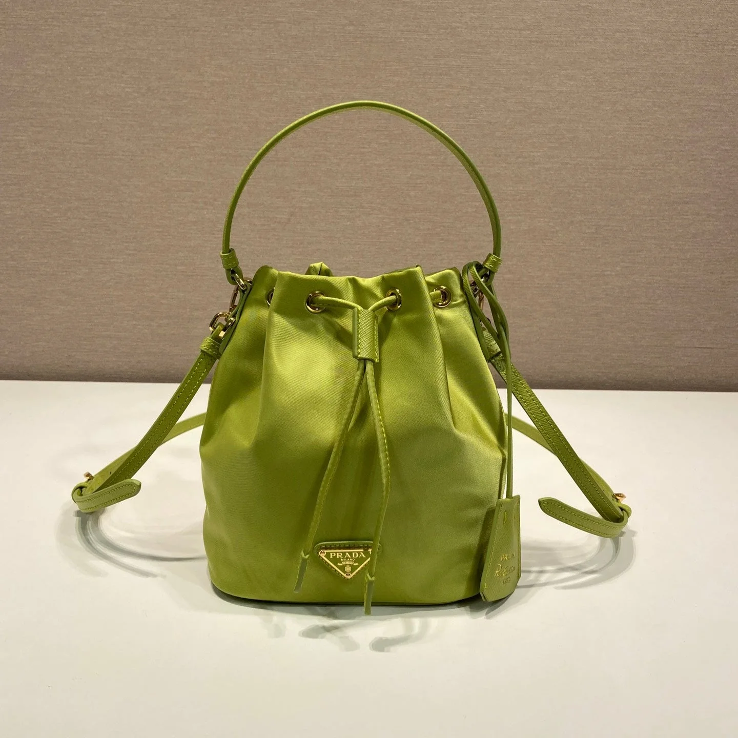 Prada BUCKET BAG 19 IN APPLE GREEN RE-NYLON AND SAFFIANO LEATHER HANDLE