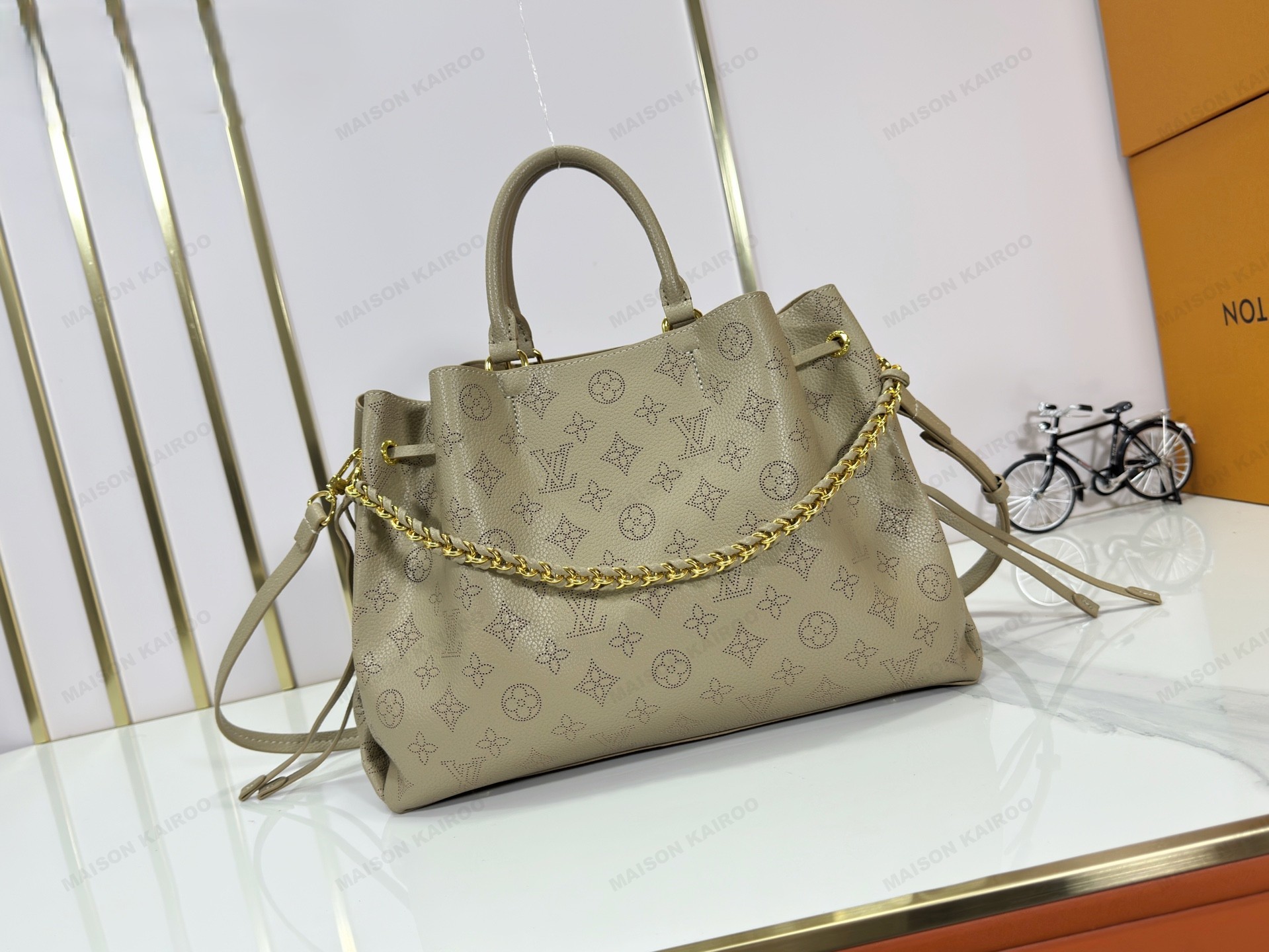 Louis Vuitton LV Mahina Bella Tote Grey Green Perforated Monogram Leather Drawstring Bucket Top Handle Bag - KAIROO