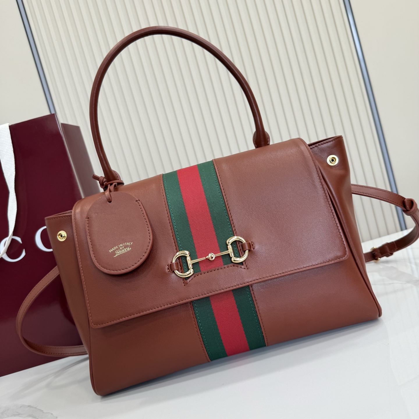 Gucci Paparazzo Medium top handle bag 875018