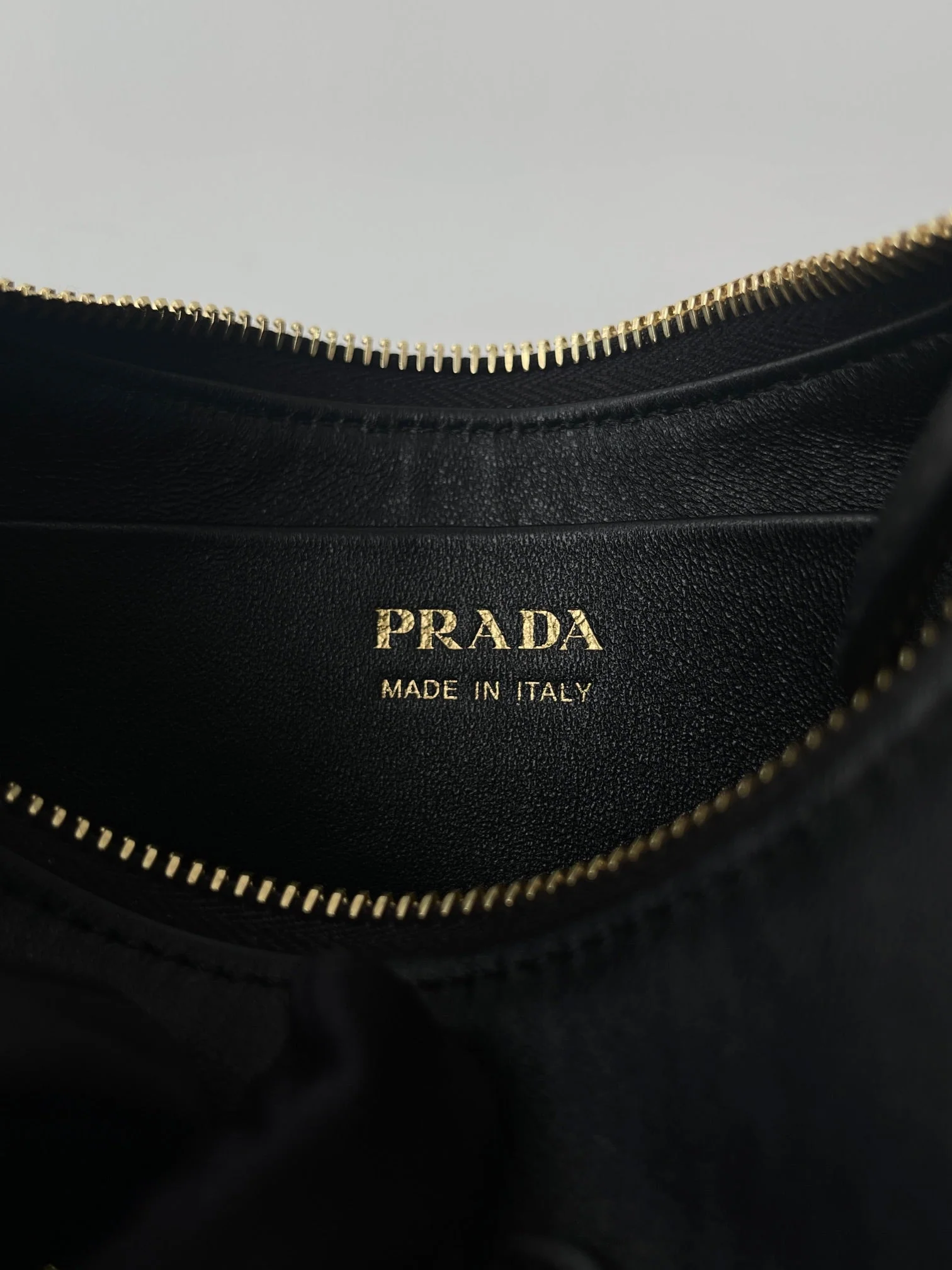 Prada ARQUÉ 22 SHOULDER BAG IN BLACK LEATHER
