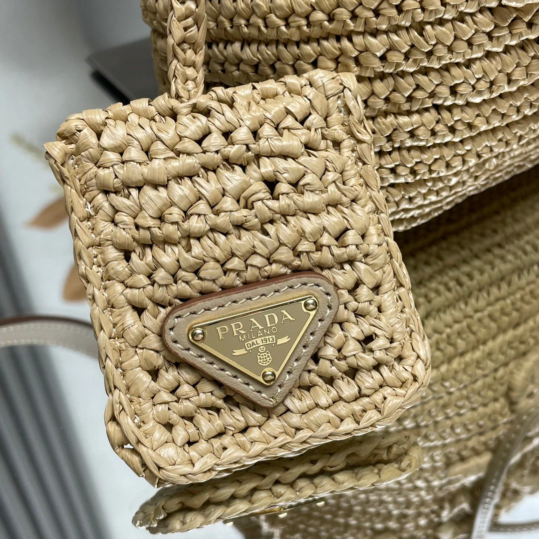 Prada  BUCKET BAG 20 IN BEIGE WOVEN RAFFIA EMBOSSED LOGO