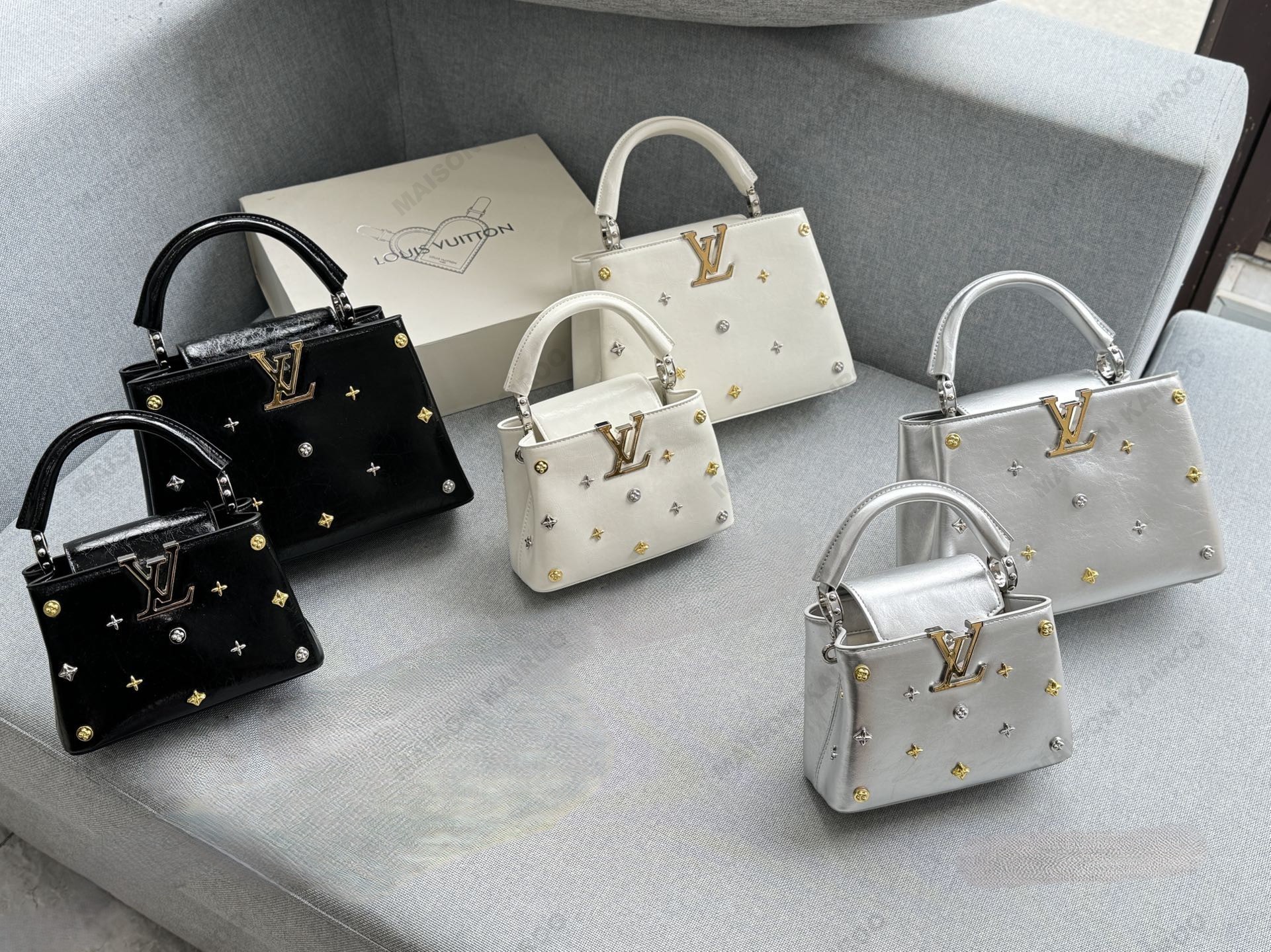 Louis Vuitton LV Capucines BB/Mini Star Logo Metallic Studded Grained Leather Top Handle Bag - KAIROO