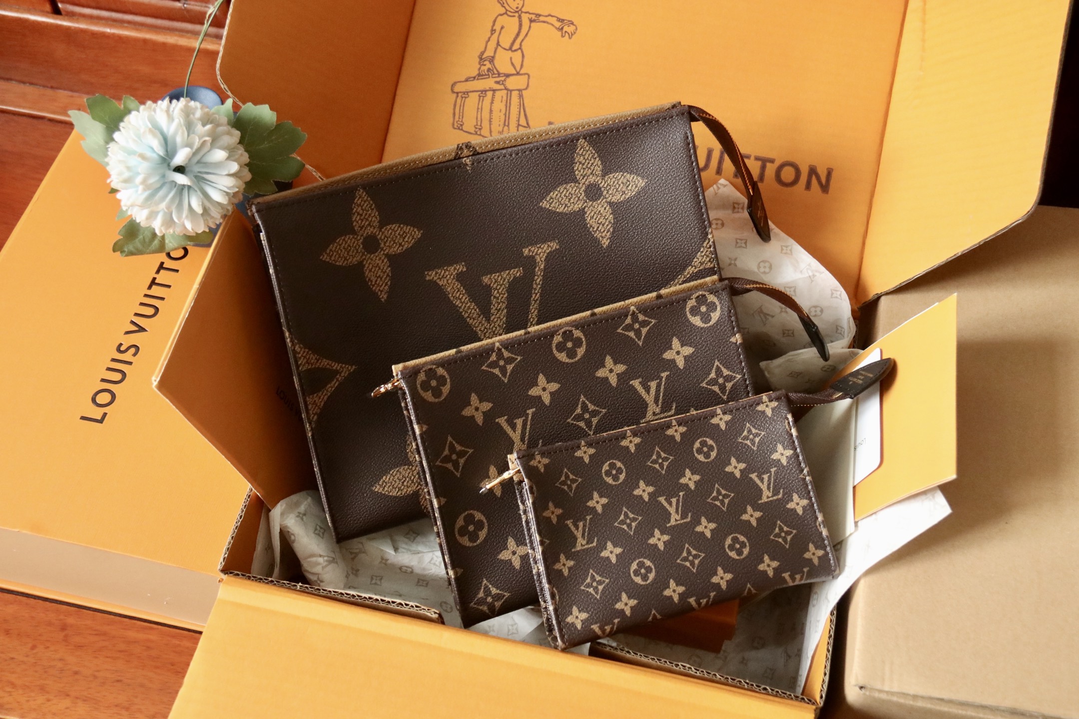 M11248 Trio Toilet Pouch in Monogram reverse coated canvas