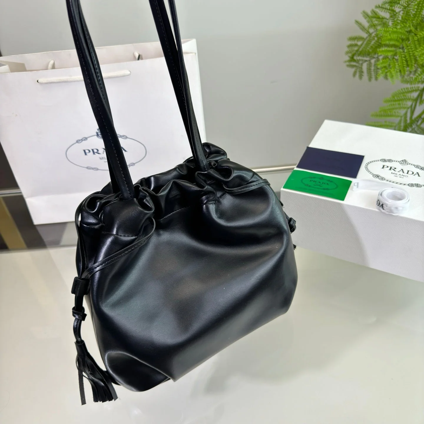 Prada DRAWSTRING BUCKET BAG 25 IN BLACK SOFT LAMBSKIN