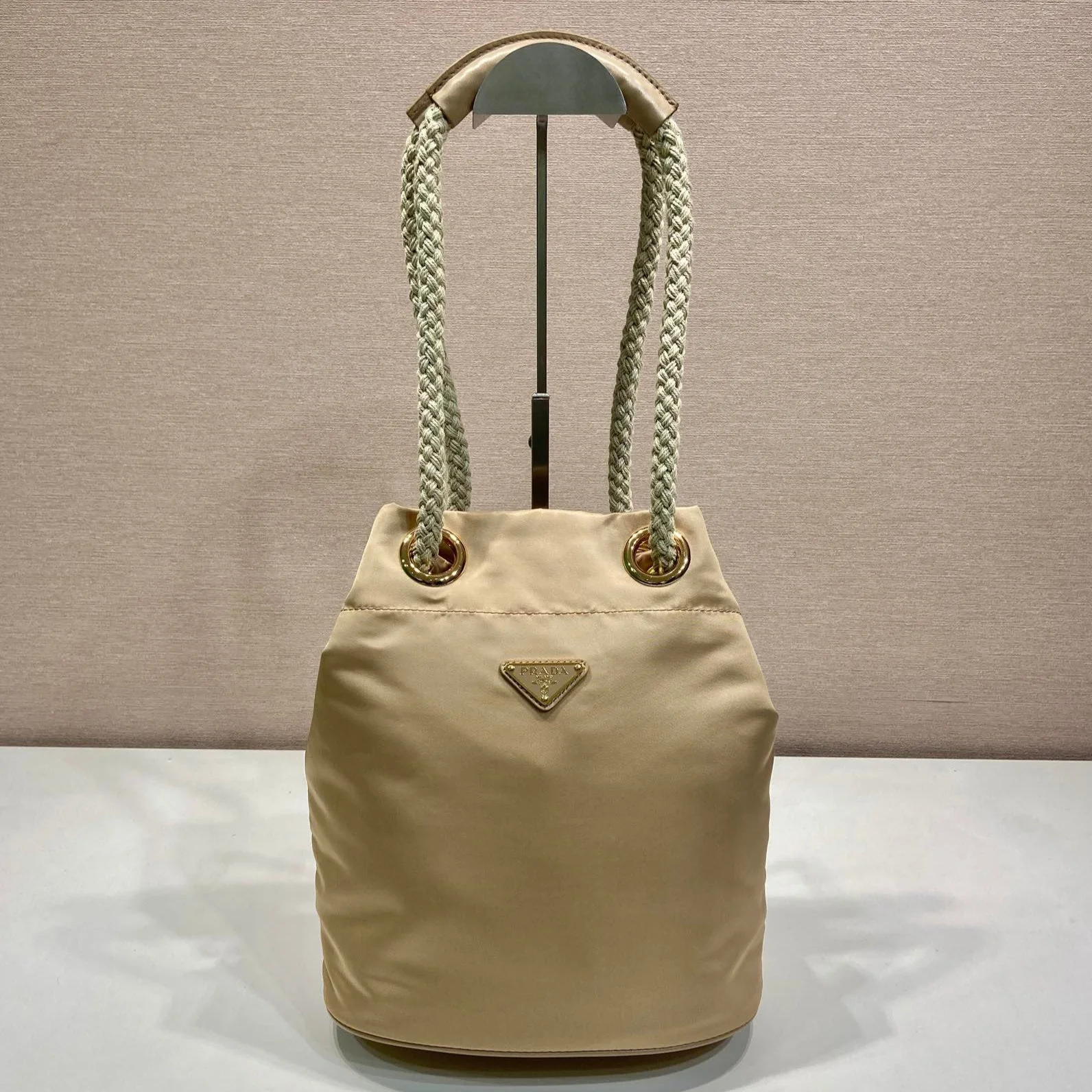Prada BUCKET BAG 28 IN BEIGE RE-NYLON GOLD LOGO