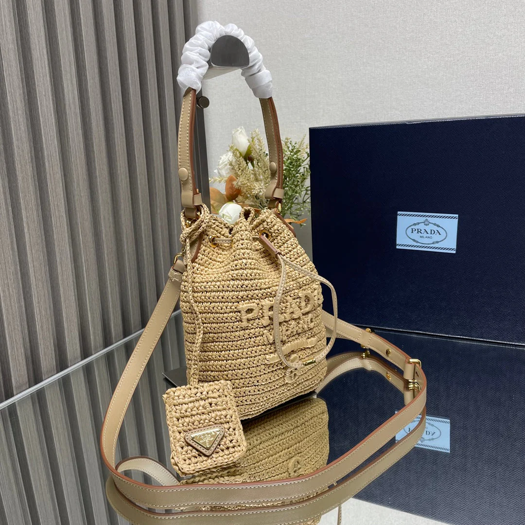 Prada  BUCKET BAG 20 IN BEIGE WOVEN RAFFIA EMBOSSED LOGO