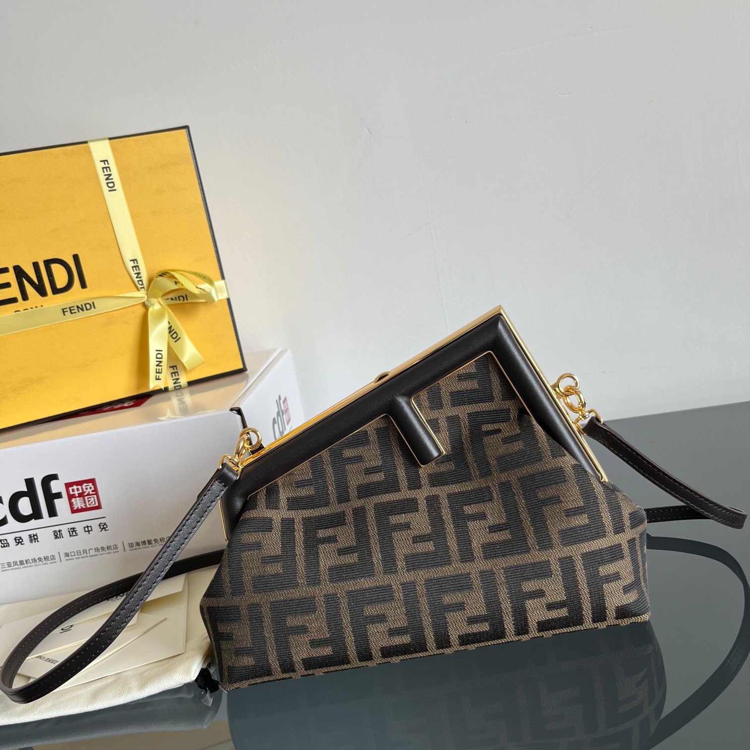 Fendi Small FF Logo Jacquard Canvas First Bag with Gold-Tone F Clasp - KAIROO
