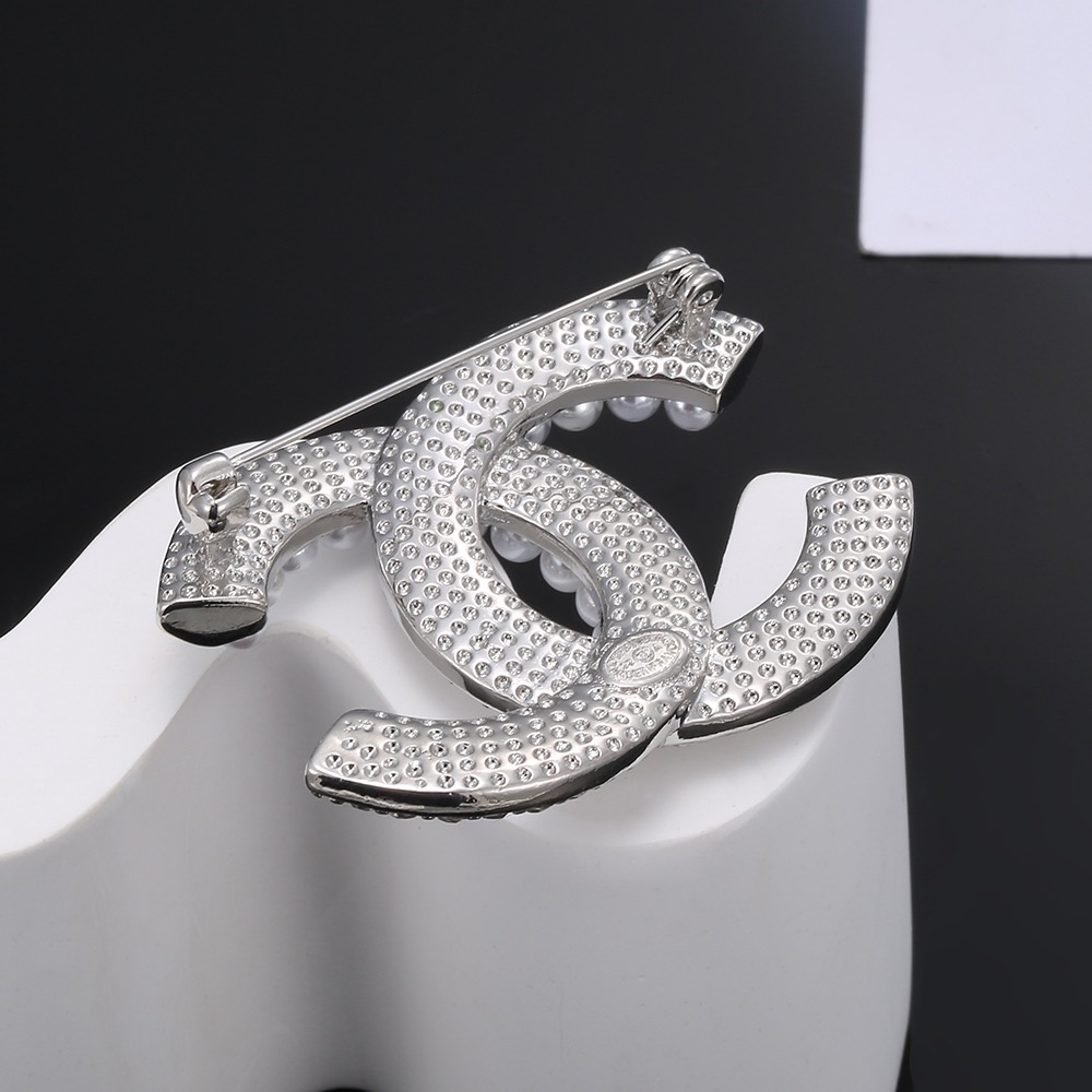 Chanel CC Brooch