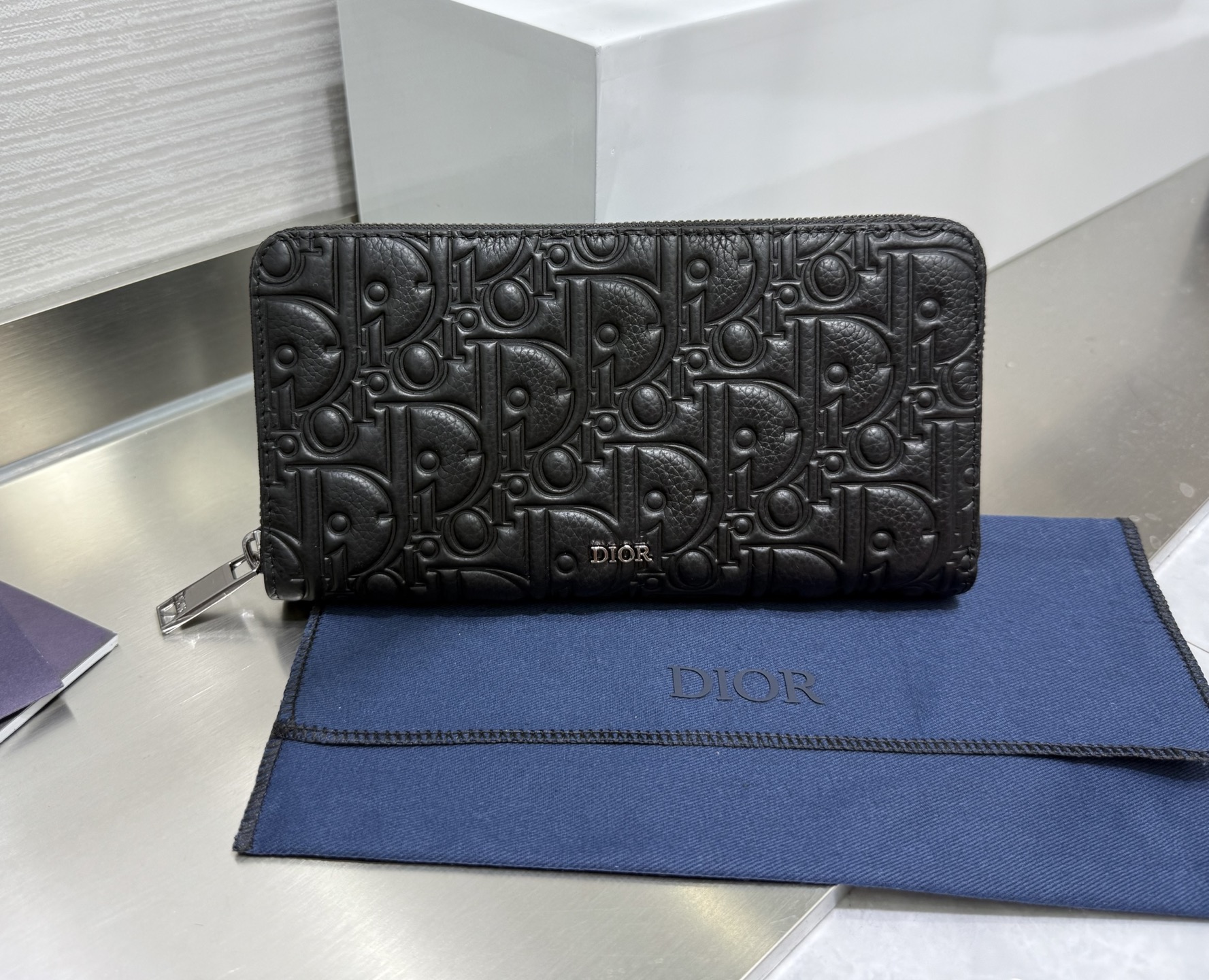 Dior Zip around Wallet in Black embossed leather