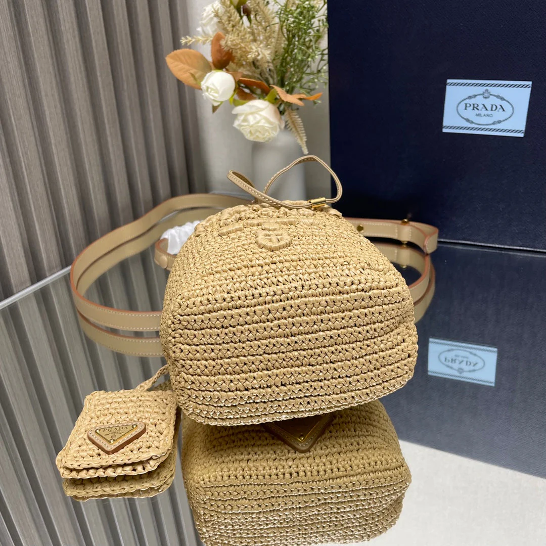 Prada  BUCKET BAG 20 IN BEIGE WOVEN RAFFIA EMBOSSED LOGO