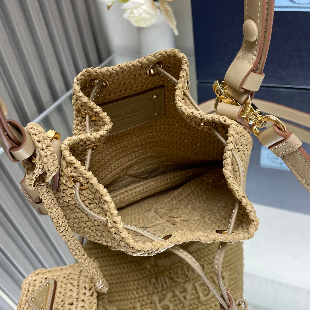 Prada  BUCKET BAG 20 IN BEIGE WOVEN RAFFIA EMBOSSED LOGO