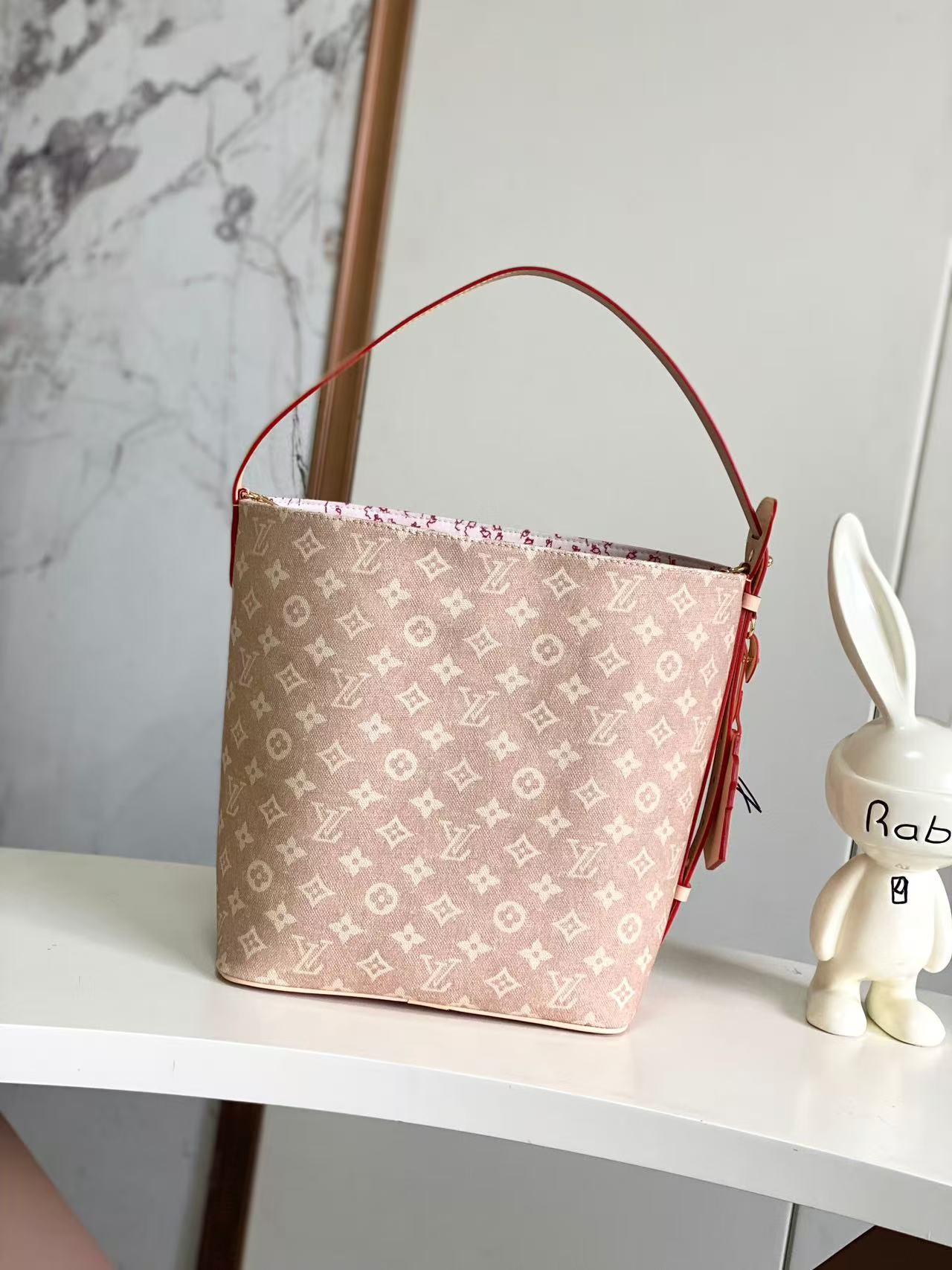 Louis Vuitton Travels With series bucket bags