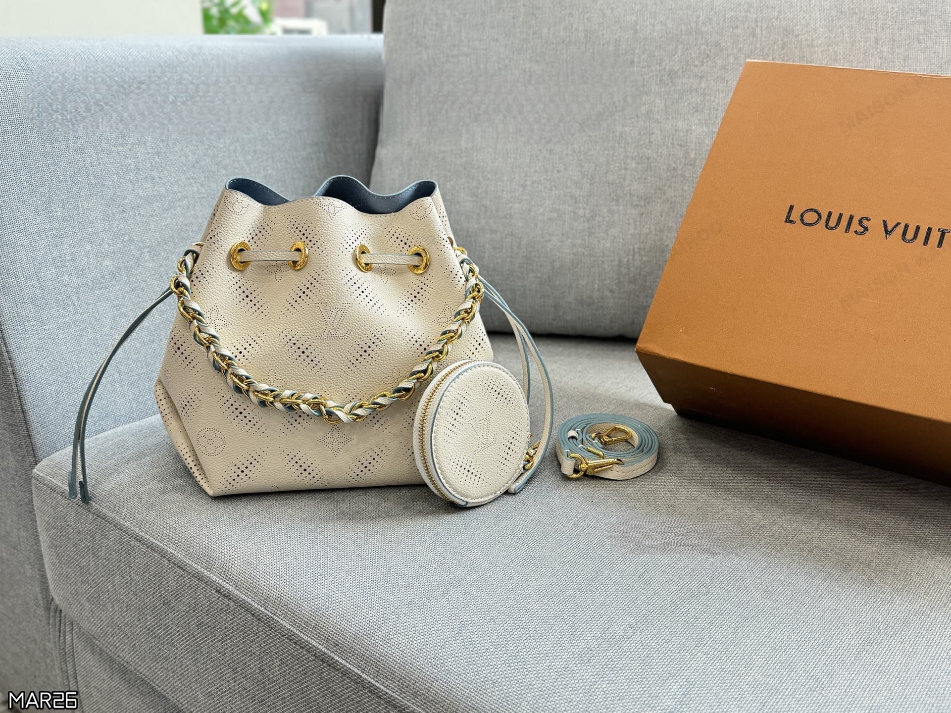 Louis Vuitton LV Mahina Bella Off White Round Perforated Monogram Leather Drawstring Bucket Shoulder Bag - KAIROO