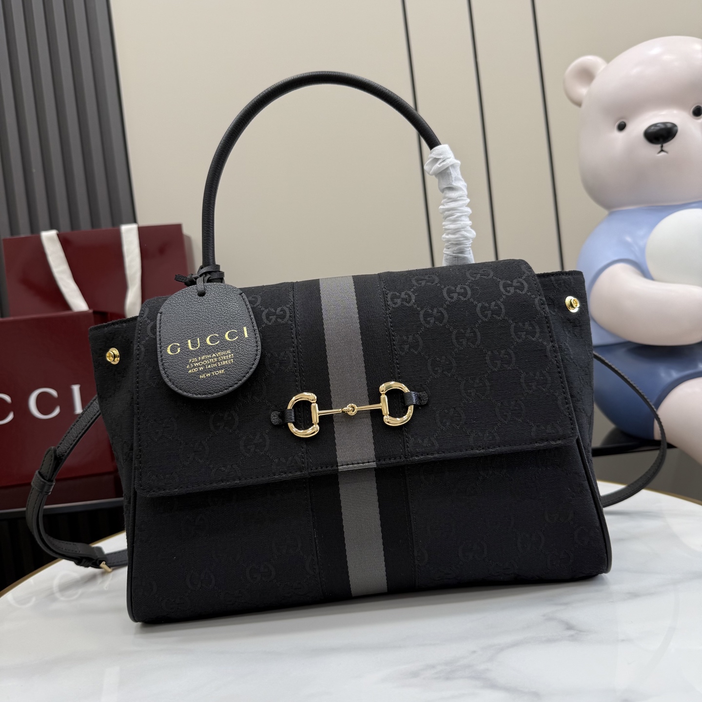 Gucci Paparazzo Medium top handle bag 875018