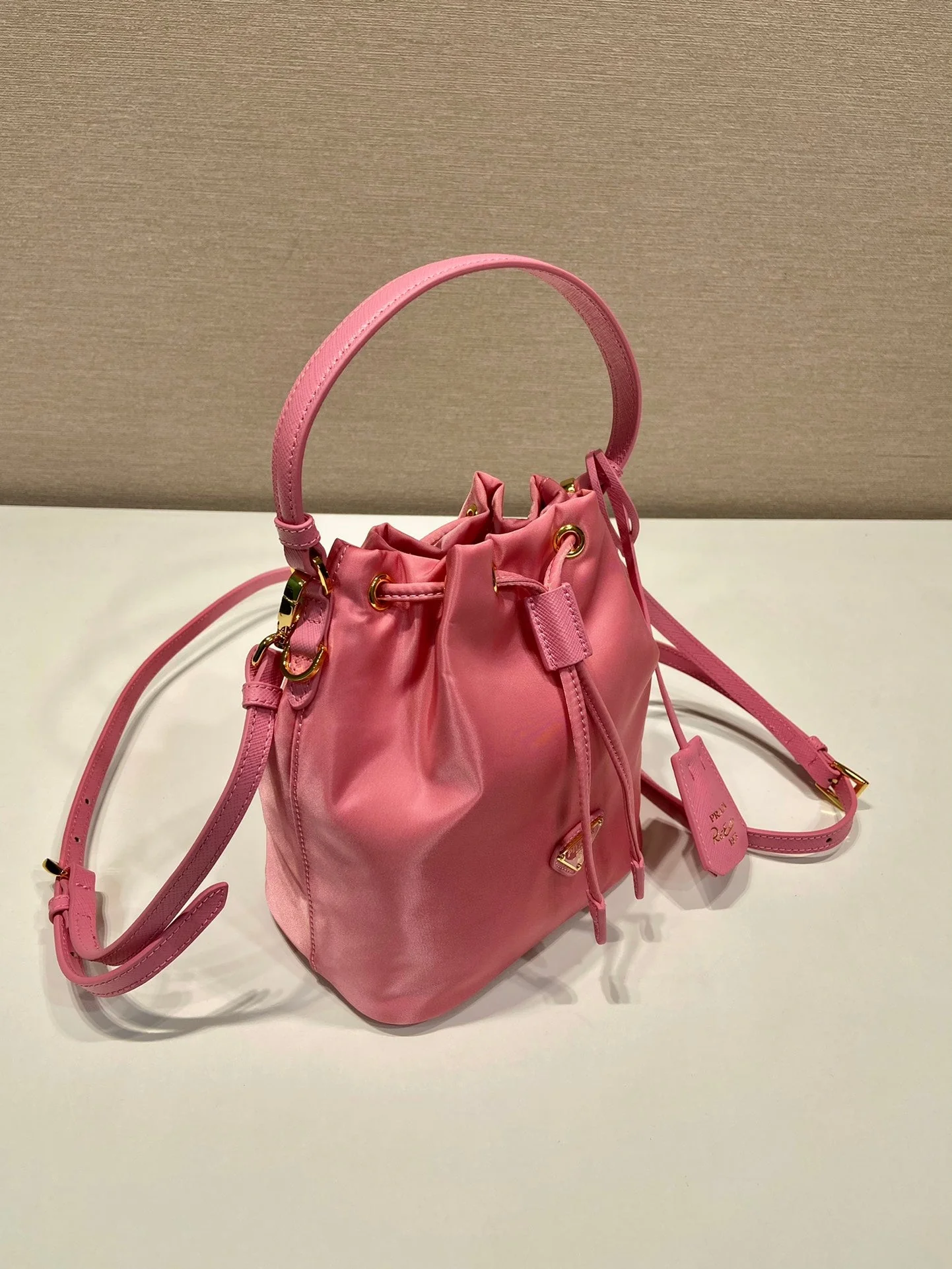 Prada BUCKET BAG 19 IN CANDY PINK RE-NYLON AND SAFFIANO LEATHER HANDLE
