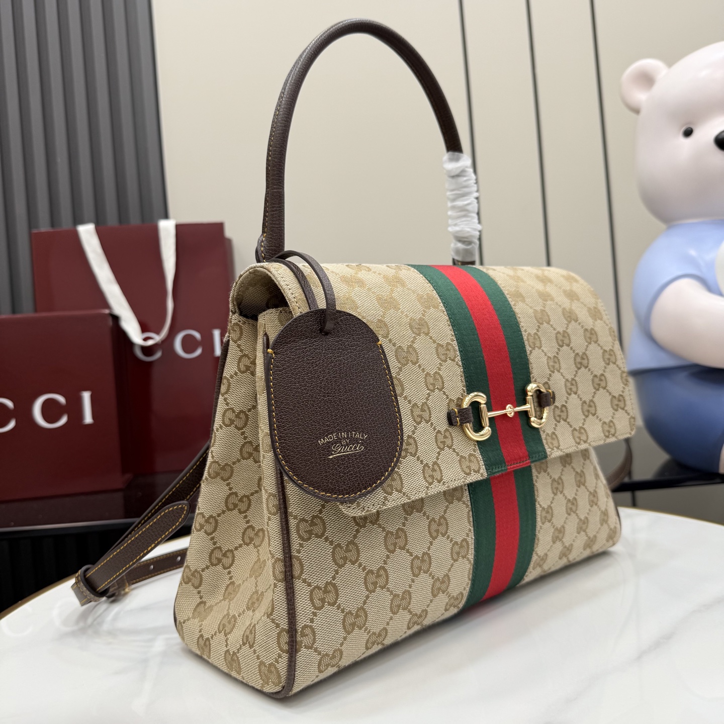 Gucci Paparazzo Medium top handle bag 875018