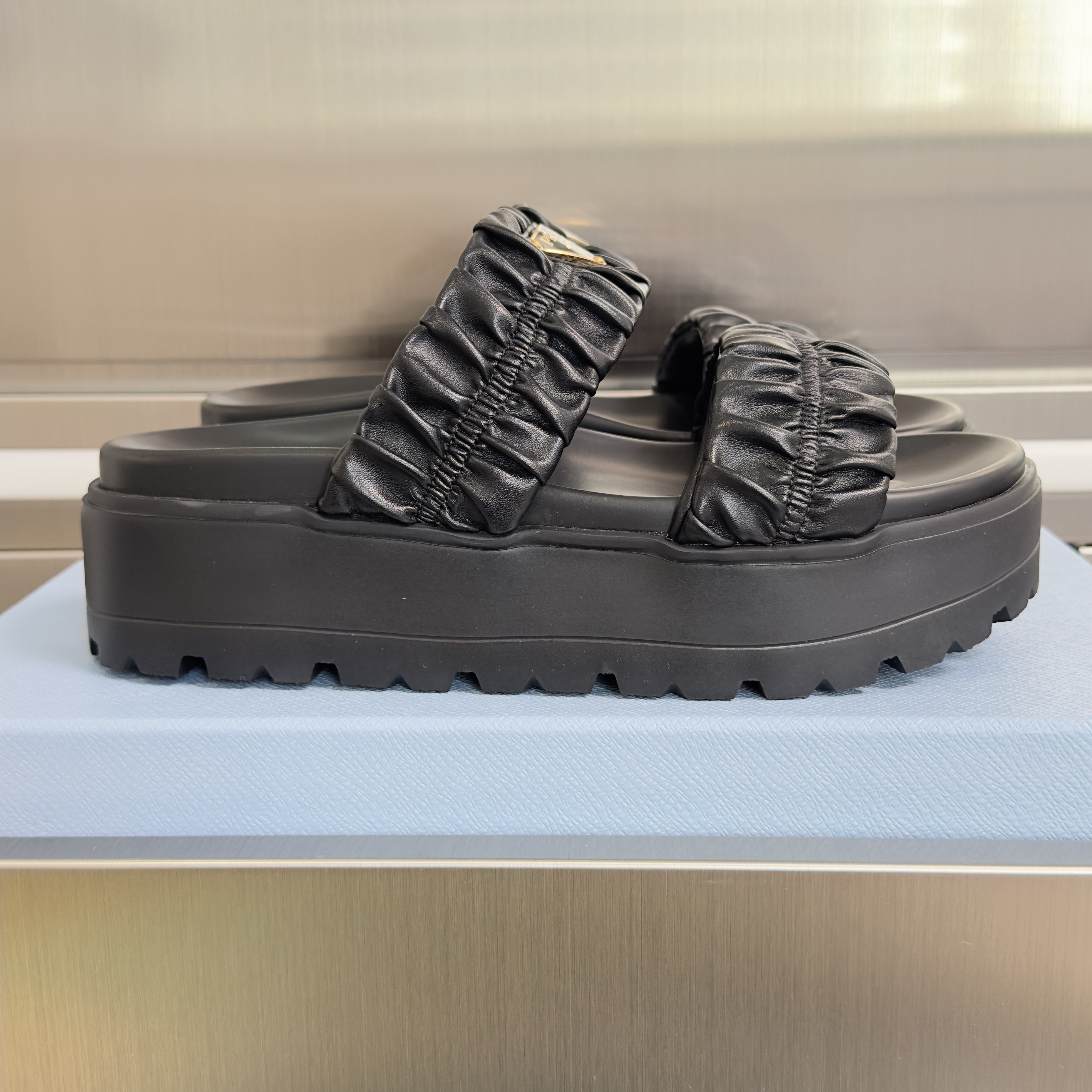 Prada Matelassé nappa leather flatform slides