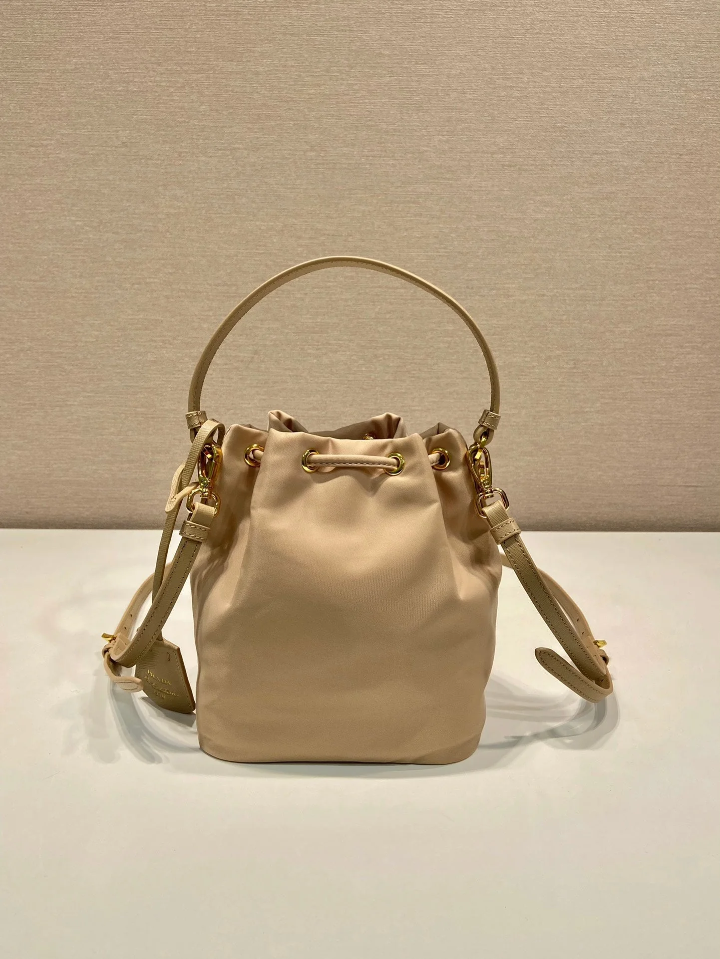 Prada BUCKET BAG 19 IN BEIGE RE-NYLON AND SAFFIANO LEATHER HANDLE