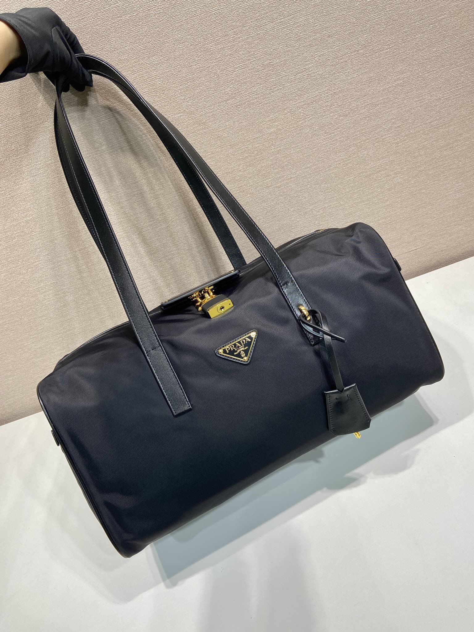 Prada TRAVEL BAG 40 IN BLACK WATERPROOF FABRIC GOLD PADLOCK