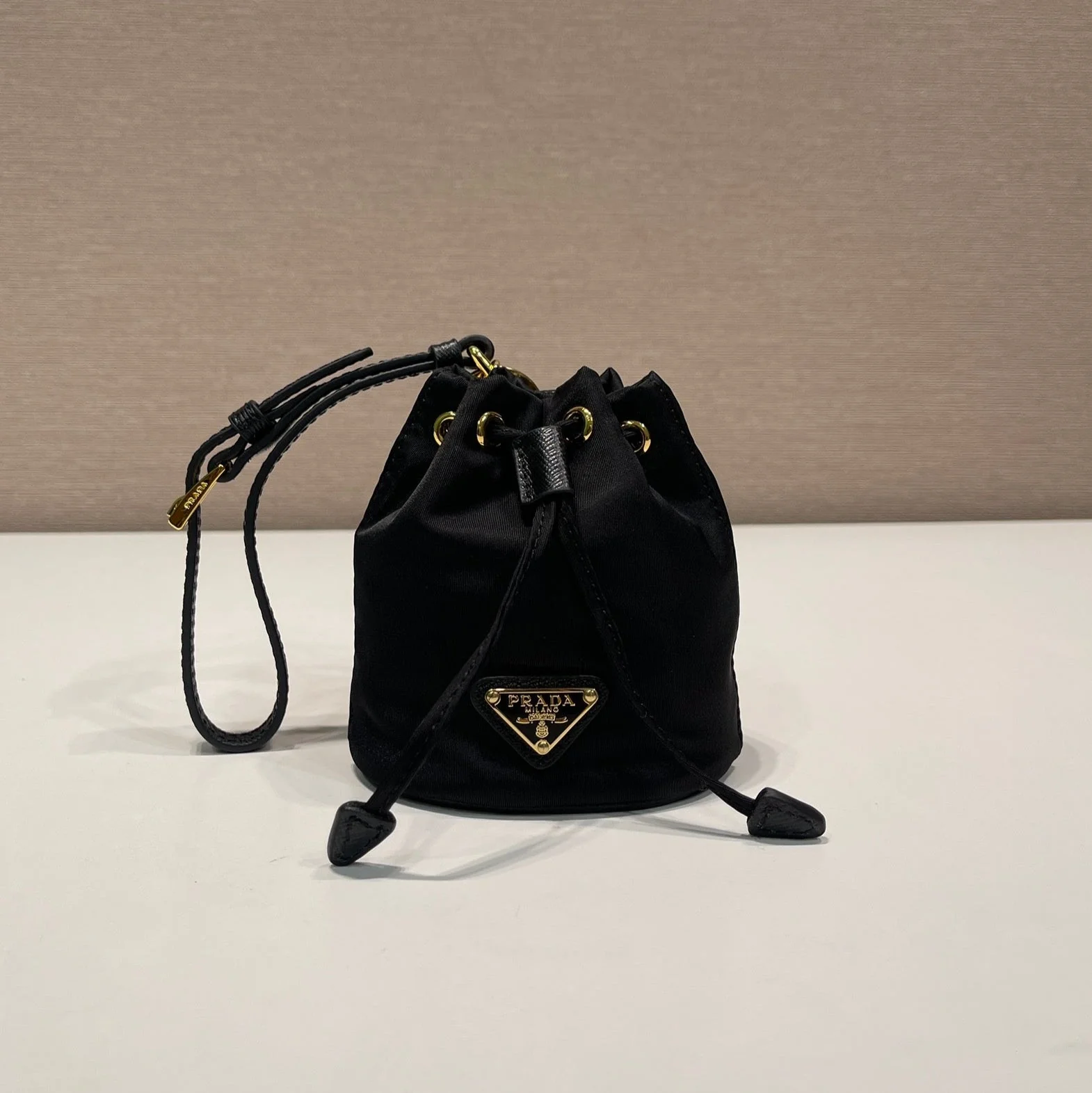 Prada MINI BUCKET BAG 10 IN BLACK RE-NYLON AND SAFFIANO LEATHER STRAP