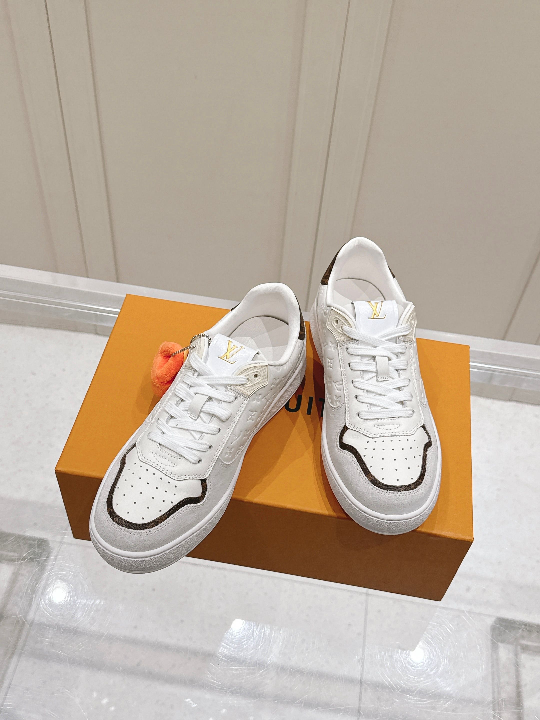 Louis Vuitton White Embossed Monogram Leather Suede Trim Low Top Rivoli Sneaker With Plush Pendant - KAIROO