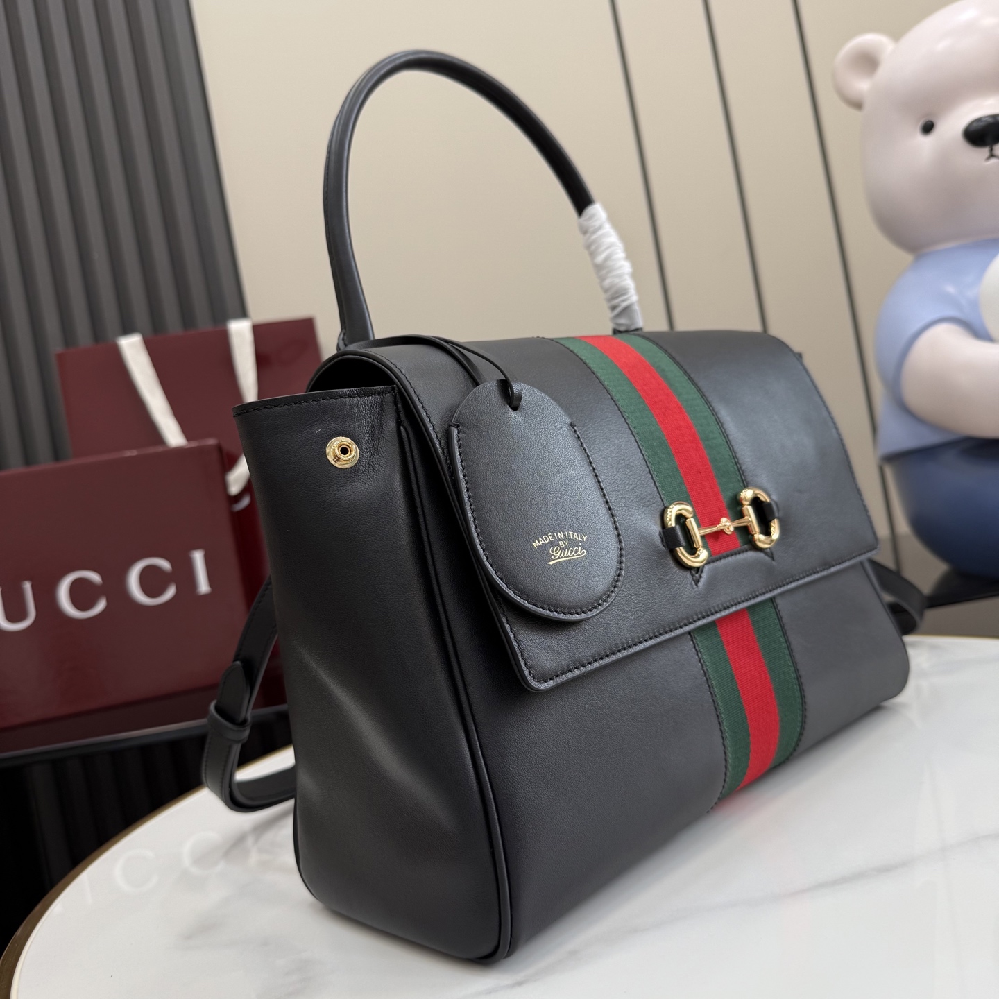 Gucci Paparazzo Medium top handle bag 875018