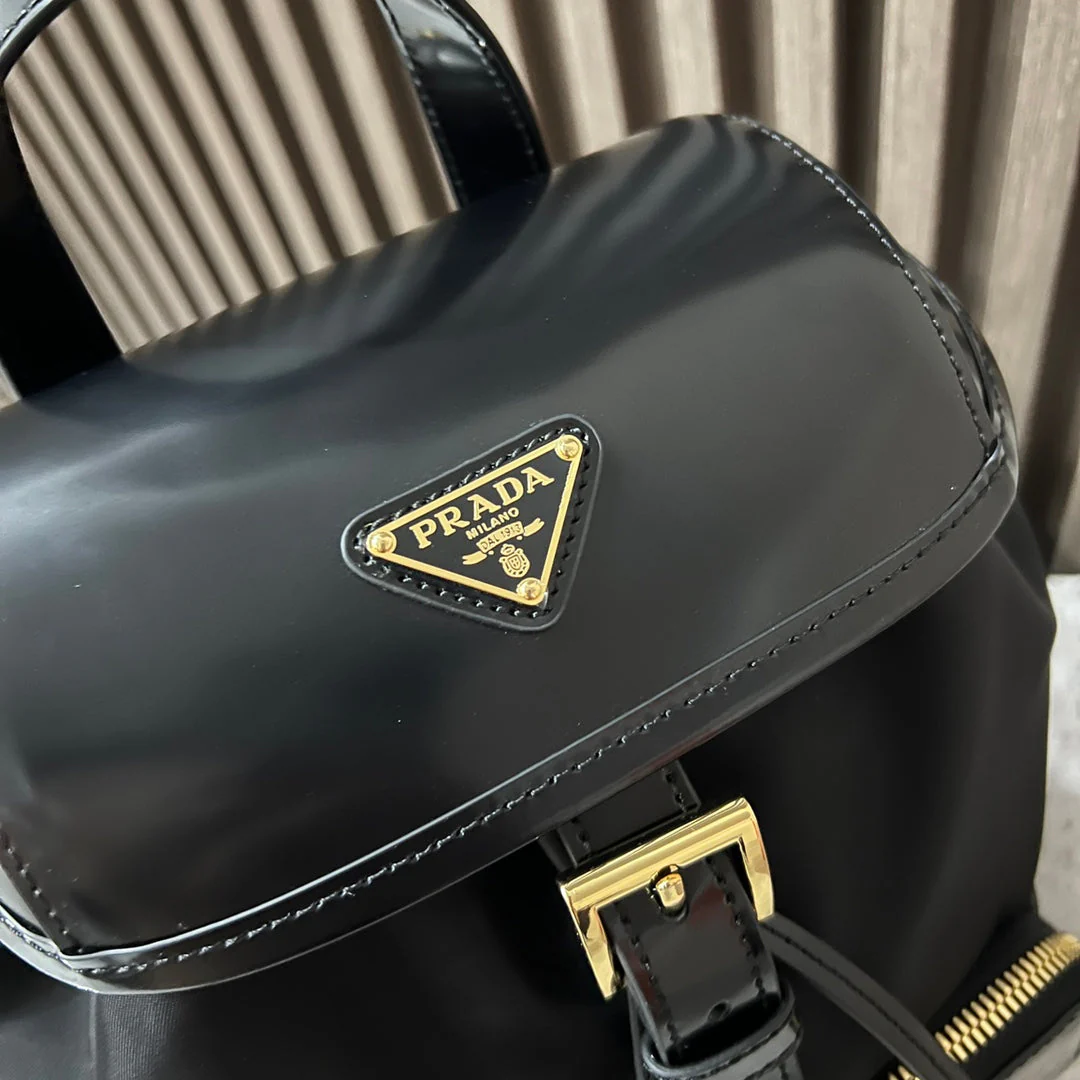 Prada BACKPACK 25 IN BLACK RE-NYLON AND GLOSSY CALFSKIN GOLD HARDWARE