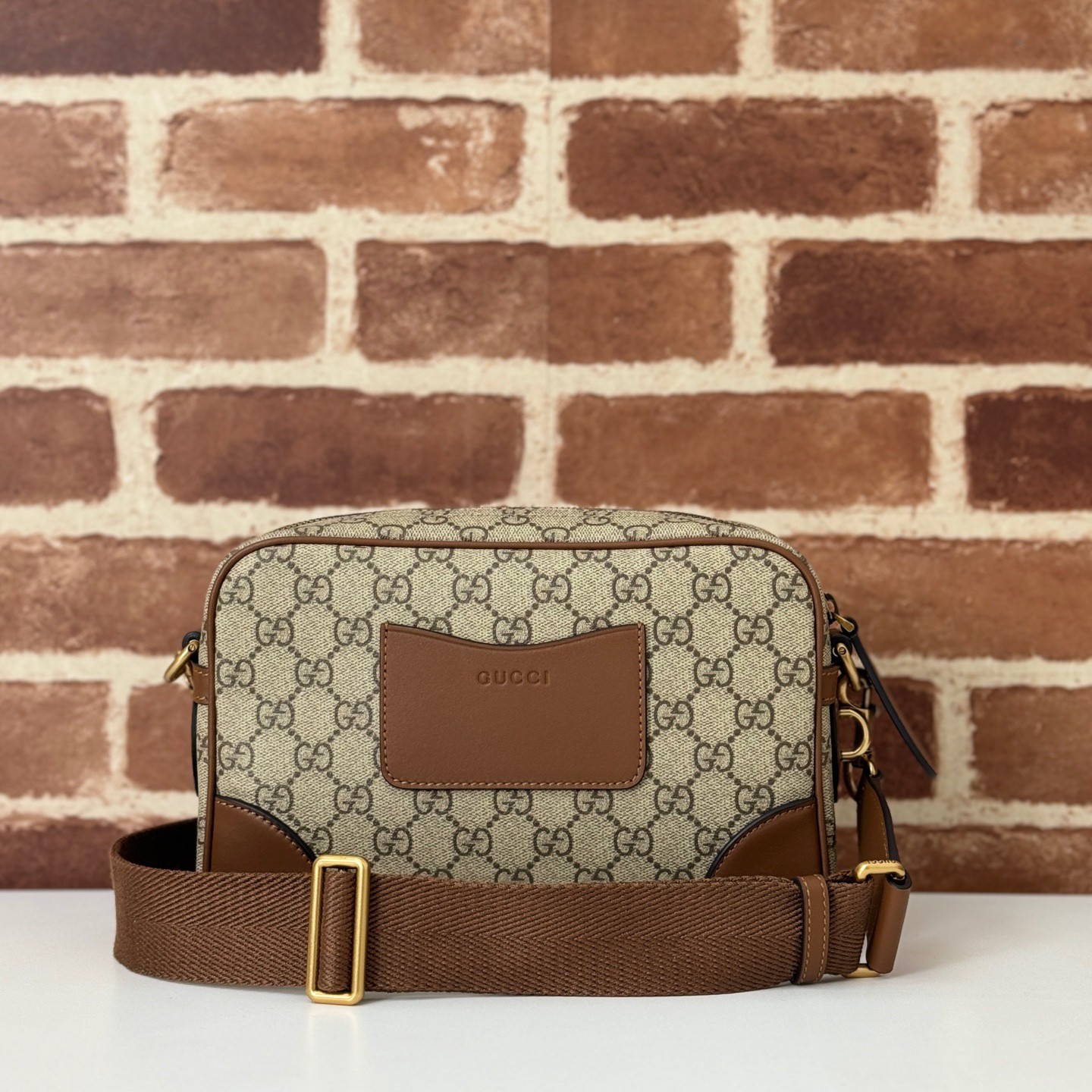 GUCCI Emblem GG small crossbody bag