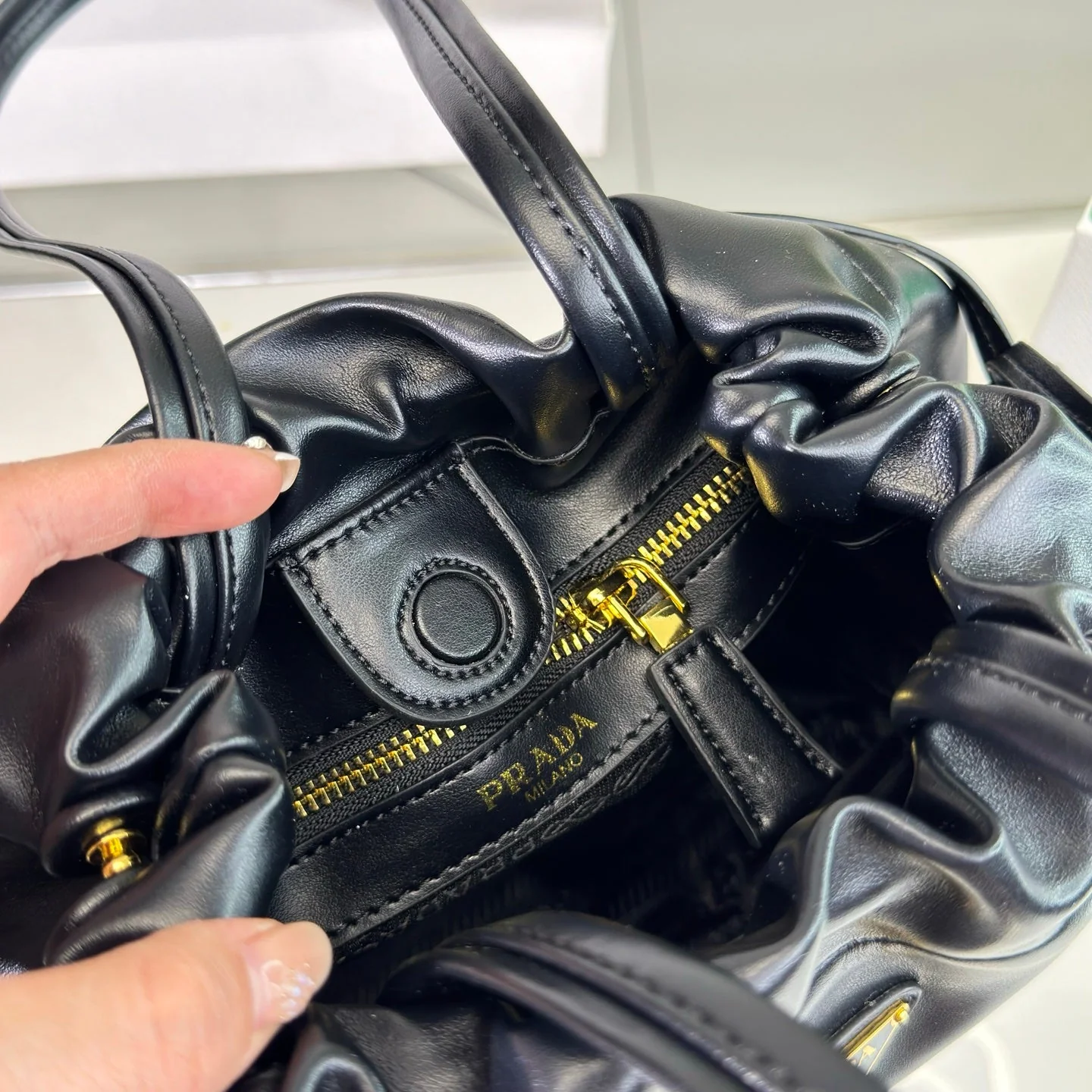 Prada DRAWSTRING BUCKET BAG 25 IN BLACK SOFT LAMBSKIN