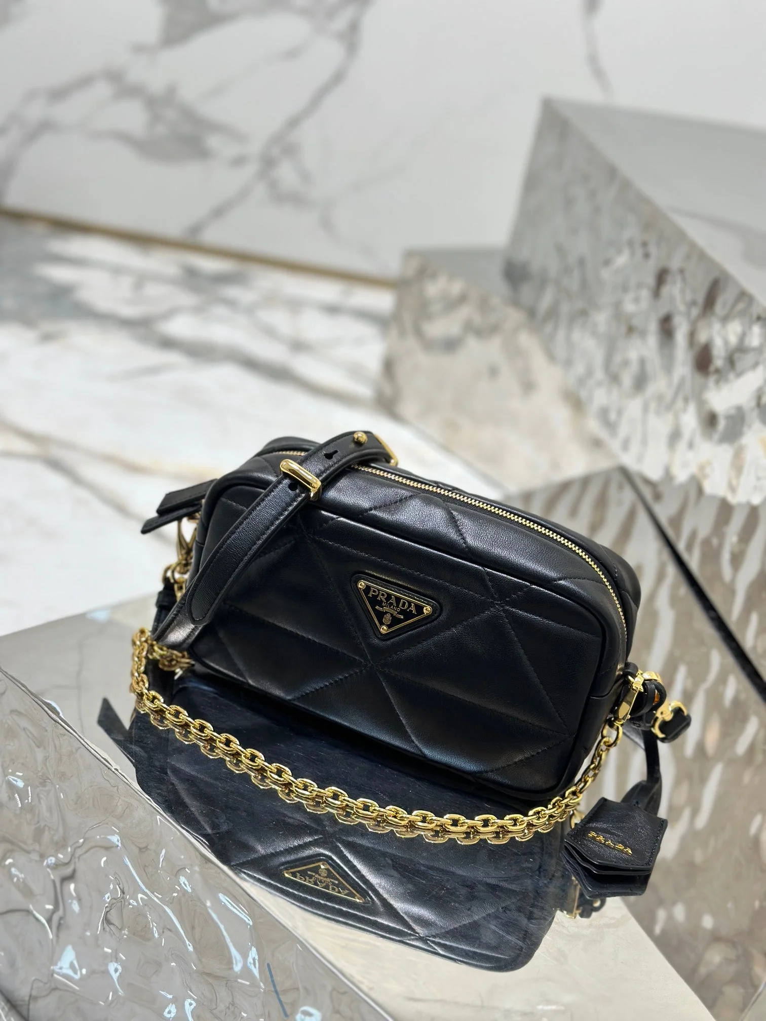 Prada CAMERA BAG 22 IN BLACK TRIANGLE PATTERN QUILTED LAMBSKIN GOLD HARDWARE
