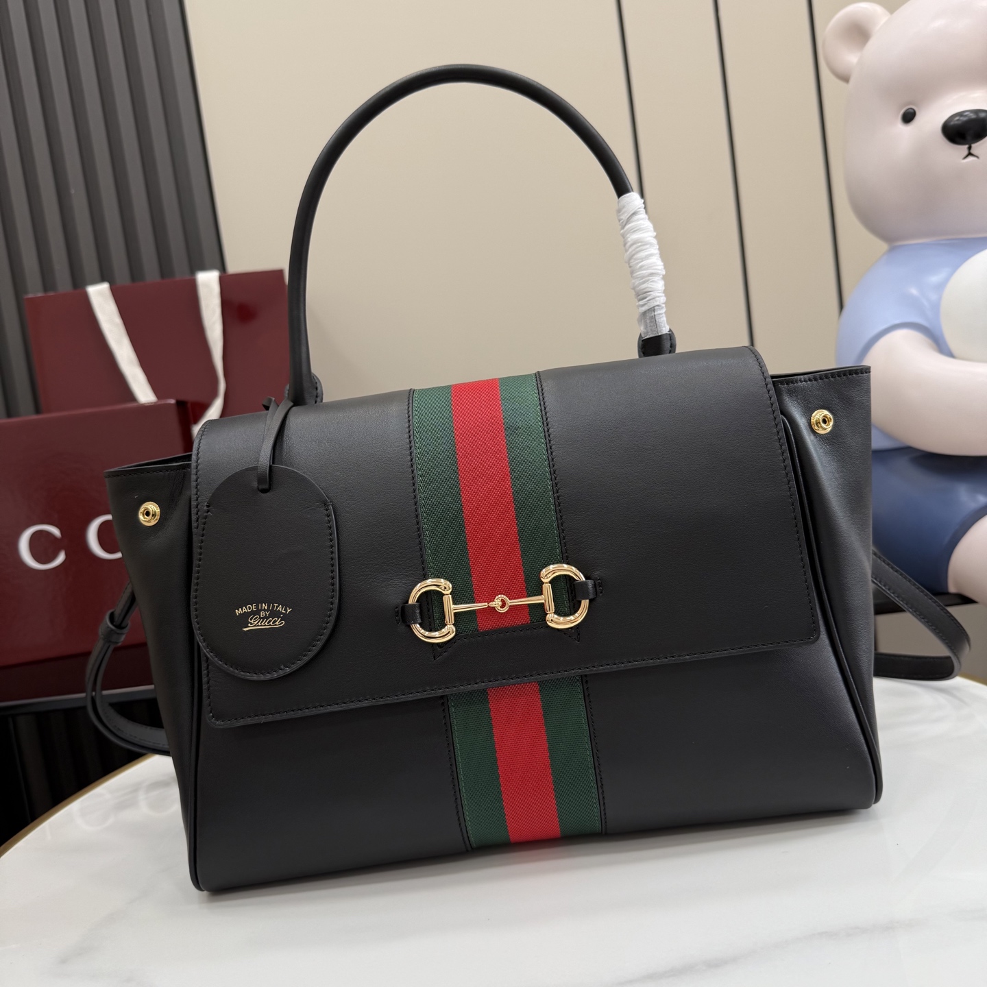 Gucci Paparazzo Medium top handle bag 875018