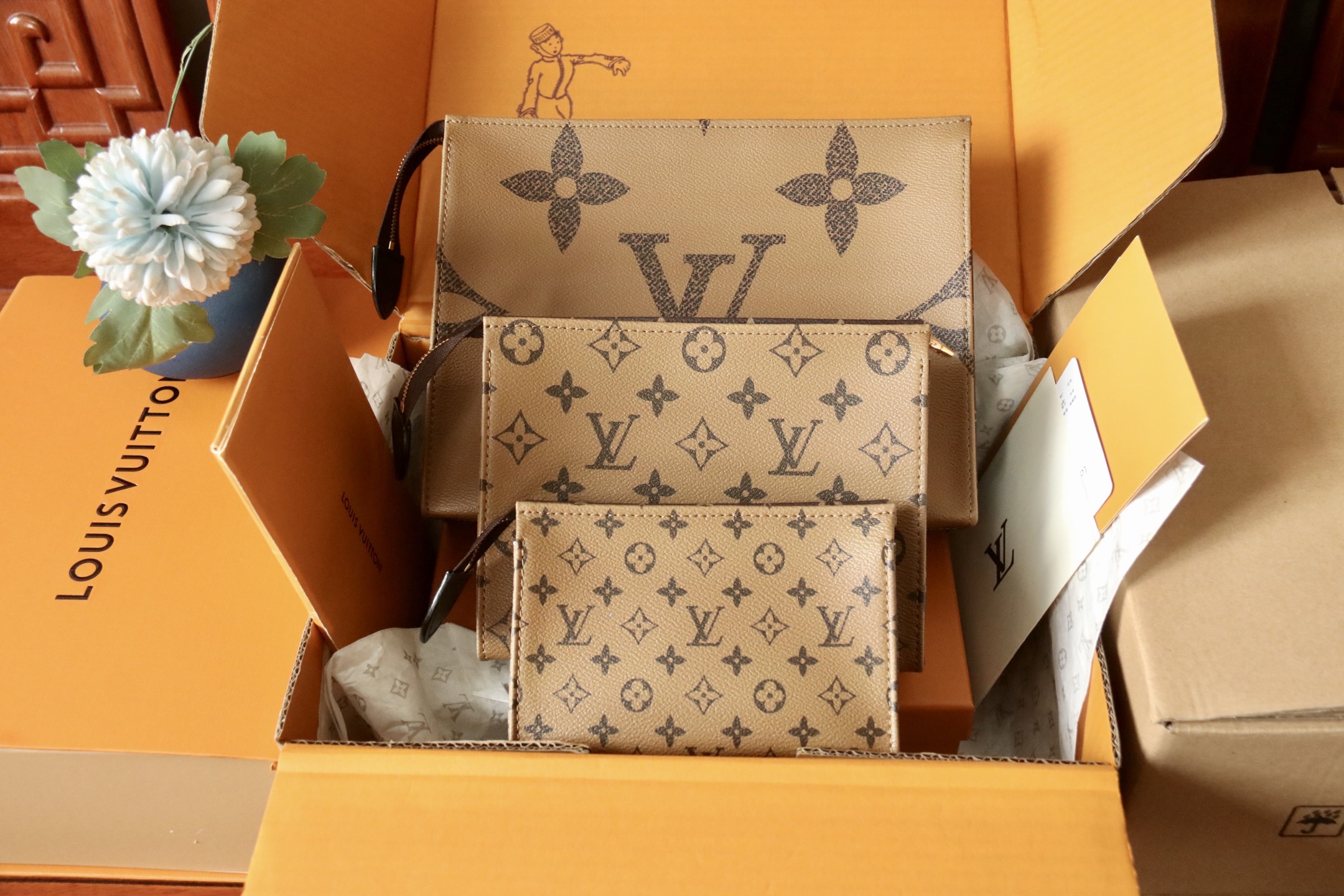 M11248 Trio Toilet Pouch in Monogram reverse coated canvas