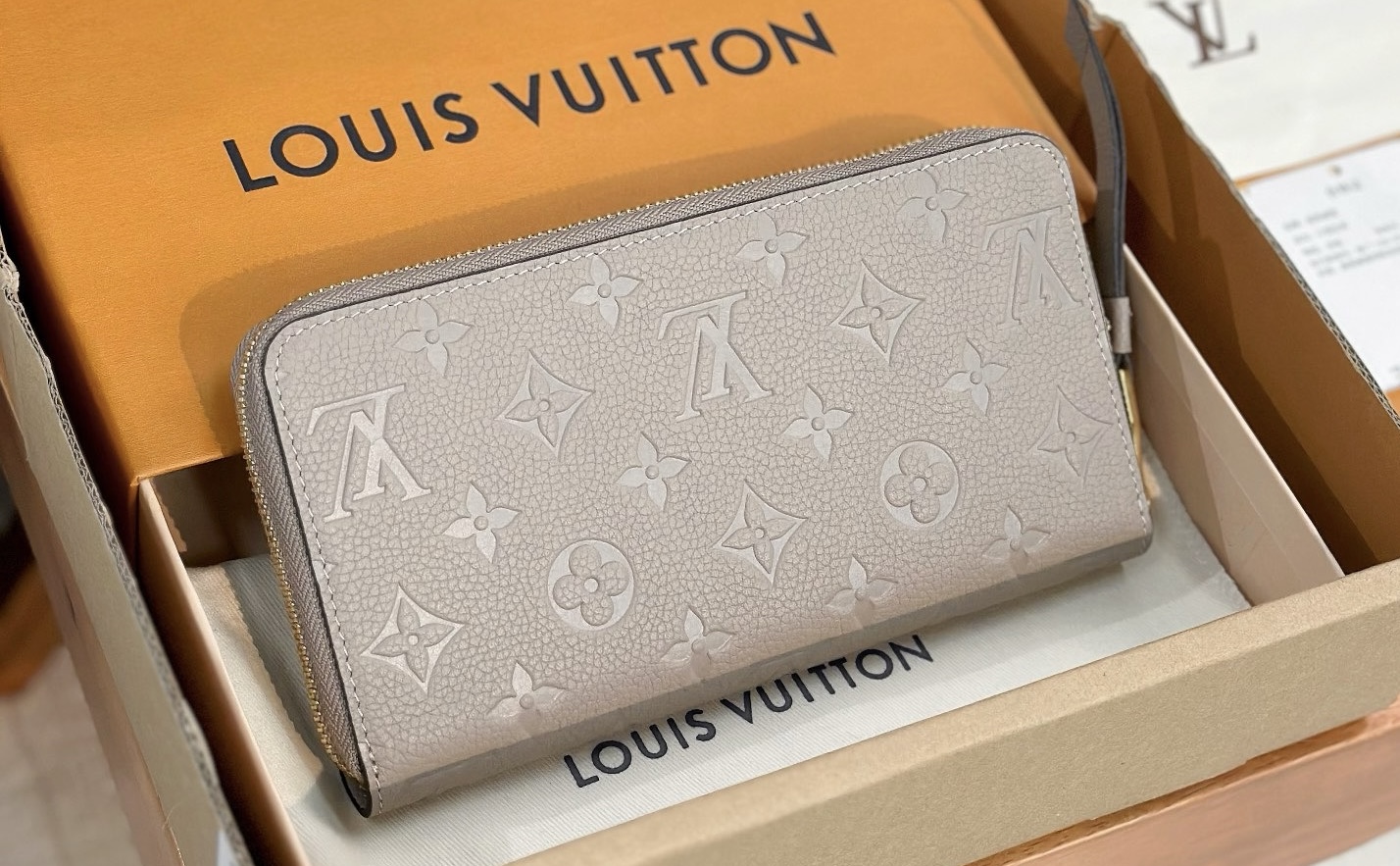 M69034 LV Zippy wallet in Tourterelle Monogram Empreinte Leather