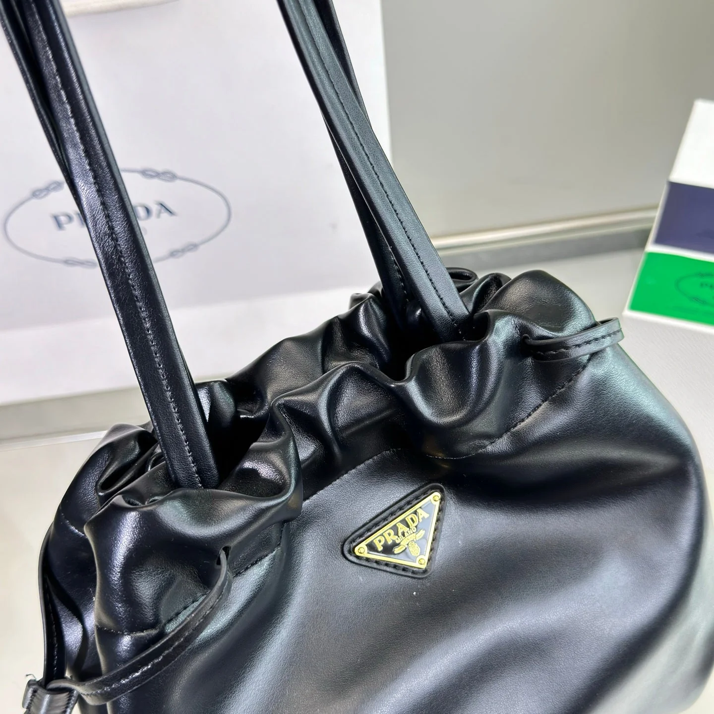 Prada DRAWSTRING BUCKET BAG 25 IN BLACK SOFT LAMBSKIN