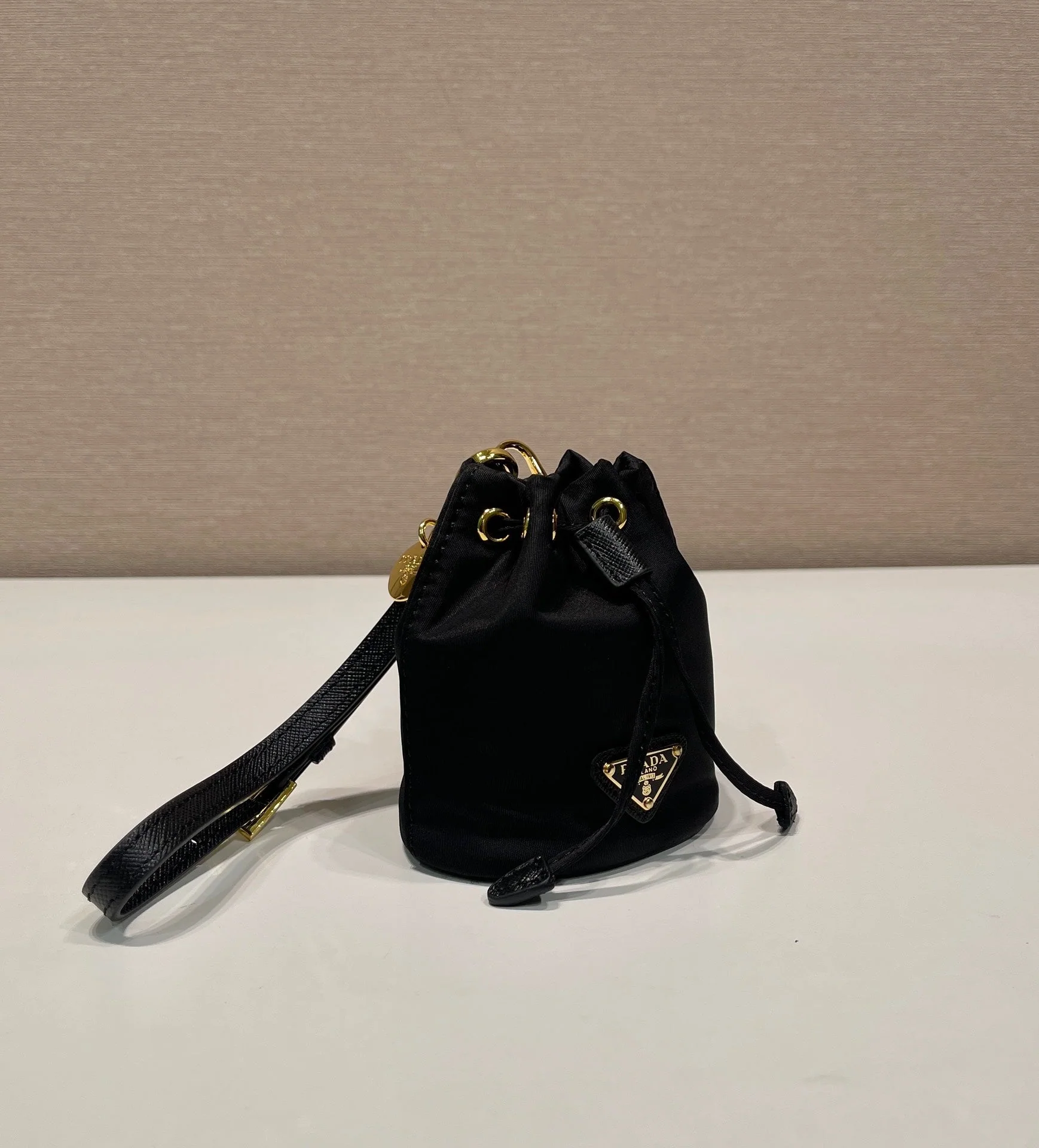 Prada MINI BUCKET BAG 10 IN BLACK RE-NYLON AND SAFFIANO LEATHER STRAP