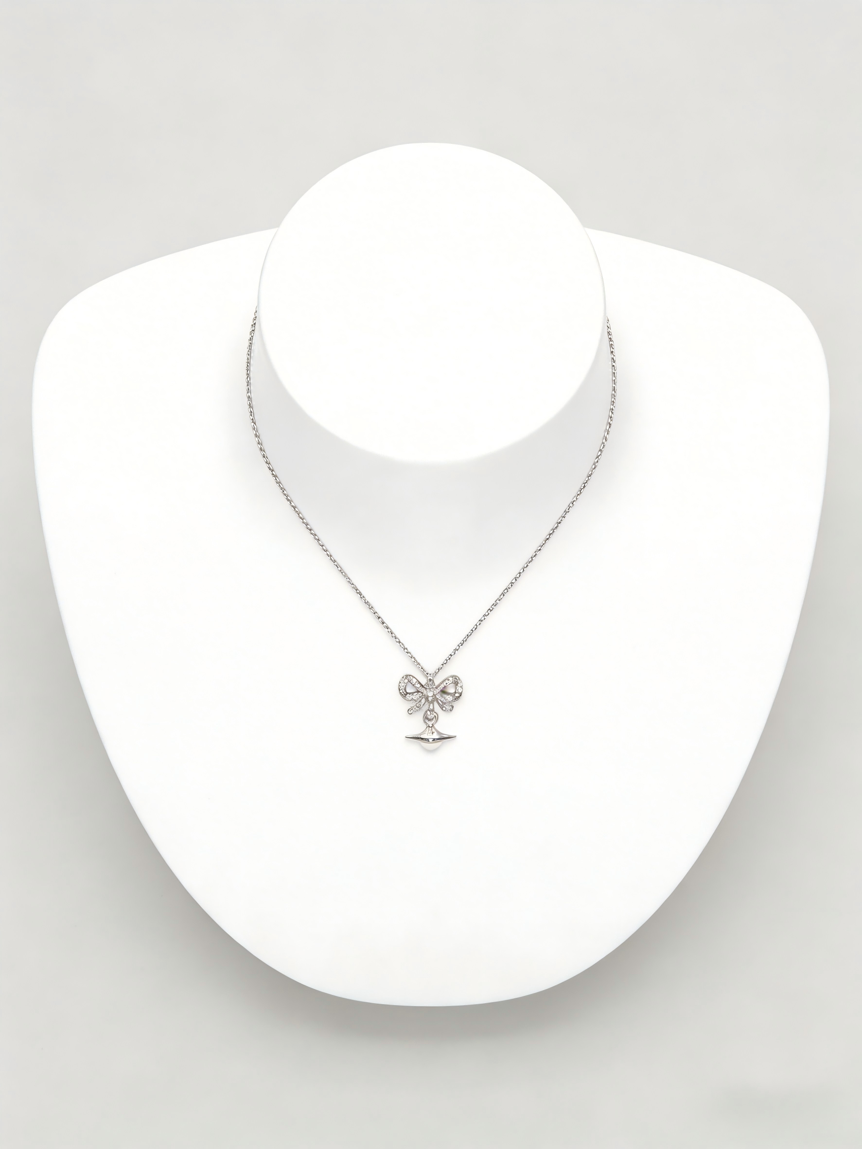 Trendy Silver Bow & Orb Pendant Necklace for Women – Dainty Chain with Sparkling Detail, Y2K Aesthetic Jewelry for Party & Daily Wear