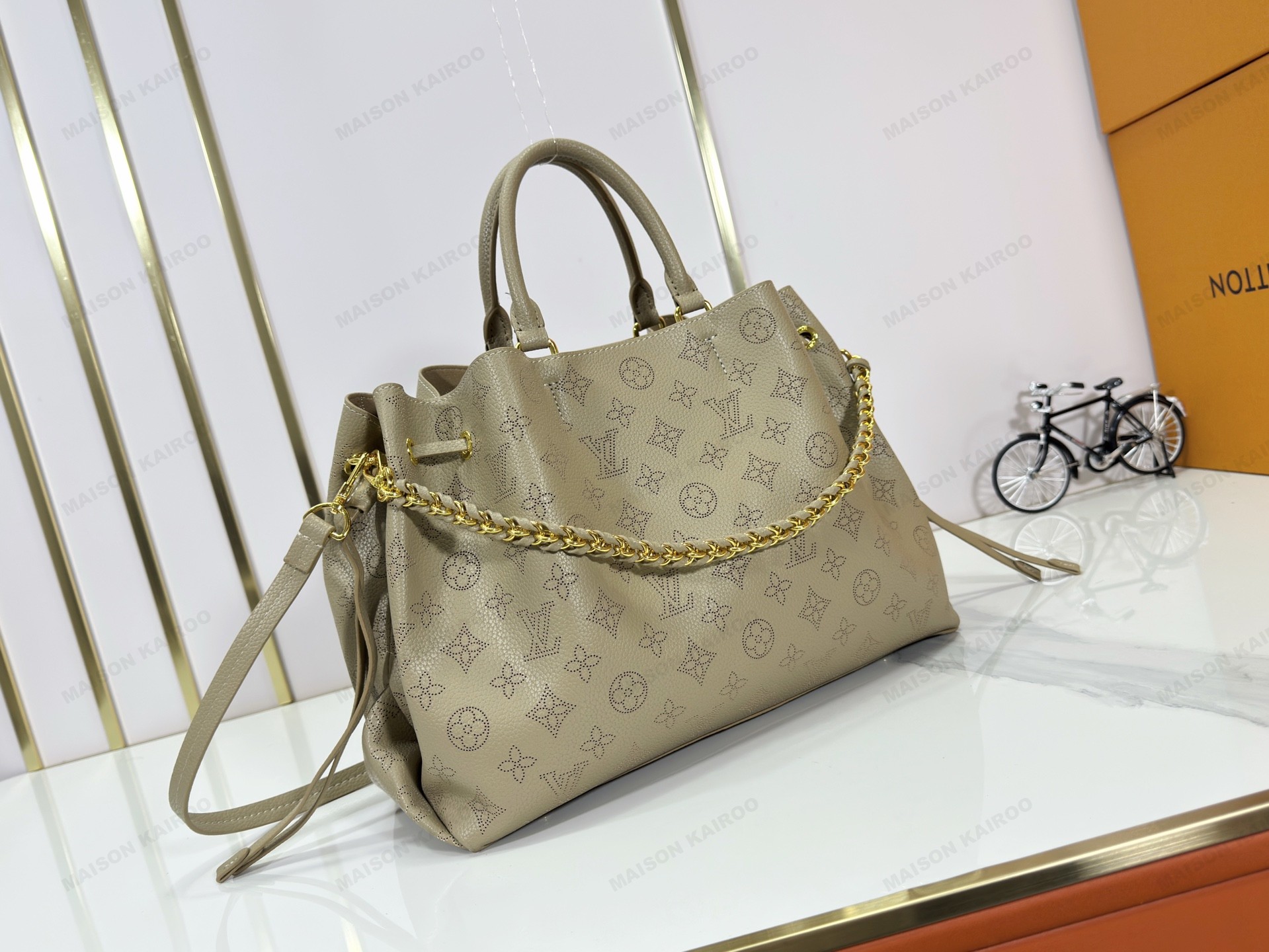 Louis Vuitton LV Mahina Bella Tote Grey Green Perforated Monogram Leather Drawstring Bucket Top Handle Bag - KAIROO