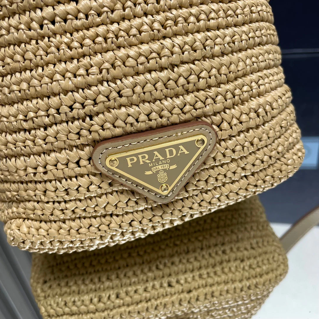 Prada  BUCKET BAG 20 IN BEIGE WOVEN RAFFIA EMBOSSED LOGO