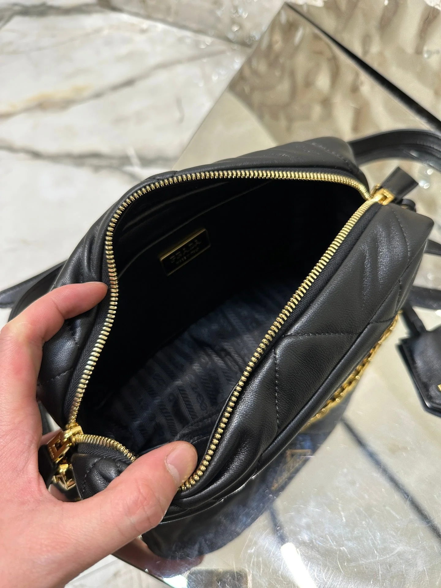 Prada CAMERA BAG 22 IN BLACK TRIANGLE PATTERN QUILTED LAMBSKIN GOLD HARDWARE