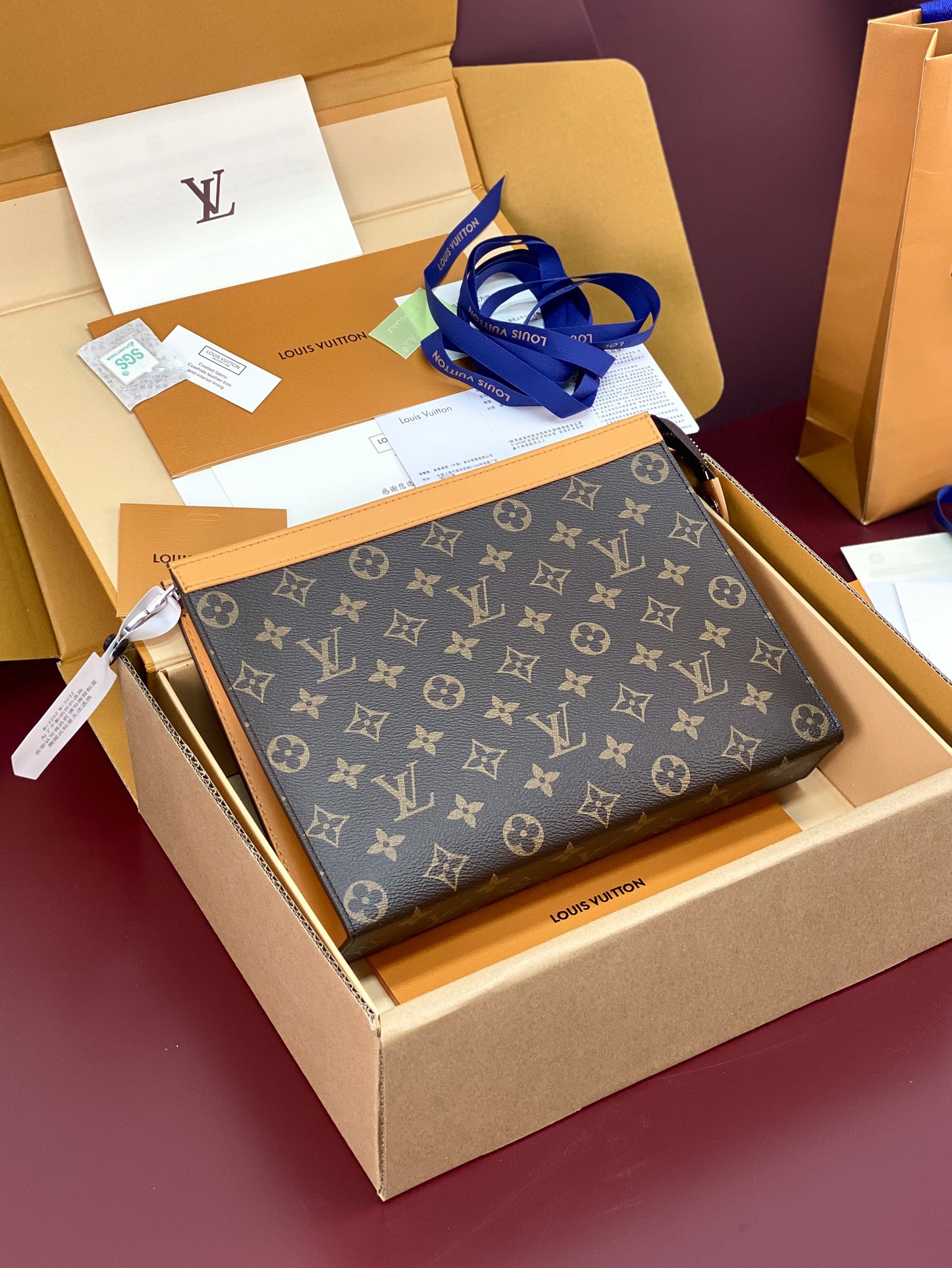 M12820 Pochette Voyage MM in Safran Yellow Monogram Macassar coated canvas