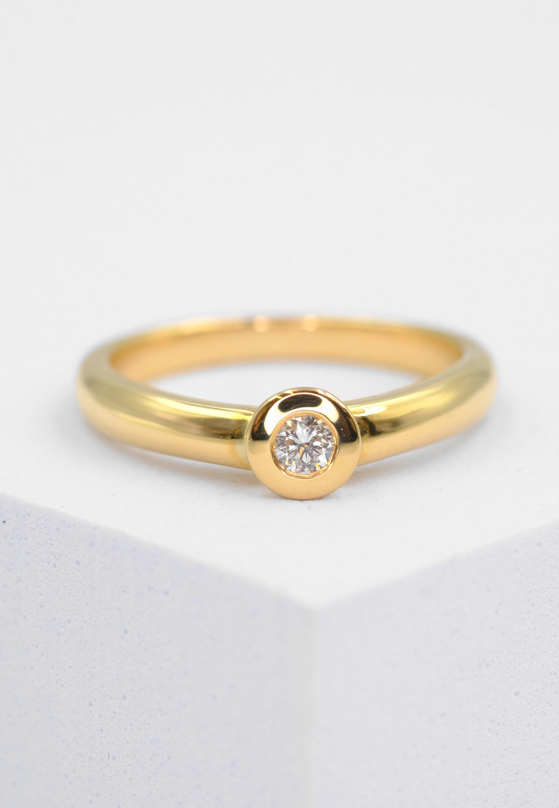 MUAU Schmuck Solitaire Ring Diamant 0.10ct. Gelbgold 750